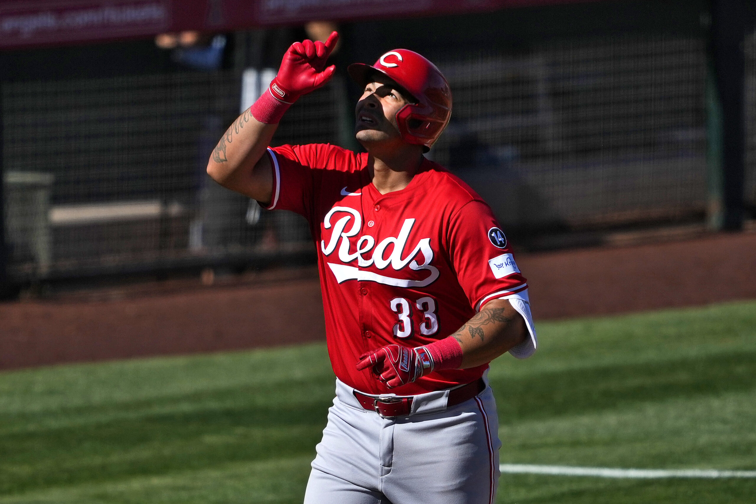 The Cincinnati Reds’ Christian Encarnacion-Strand round the bases after hitting...