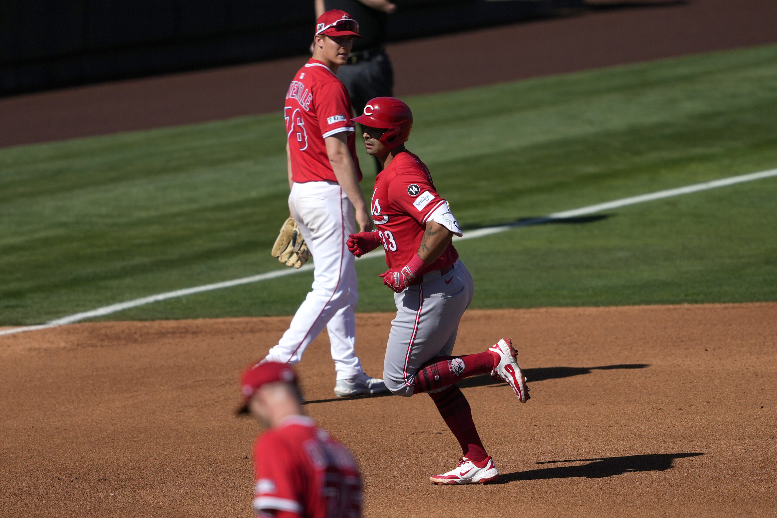 The Cincinnati Reds’ Christian Encarnacion-Strand round the bases after hitting...