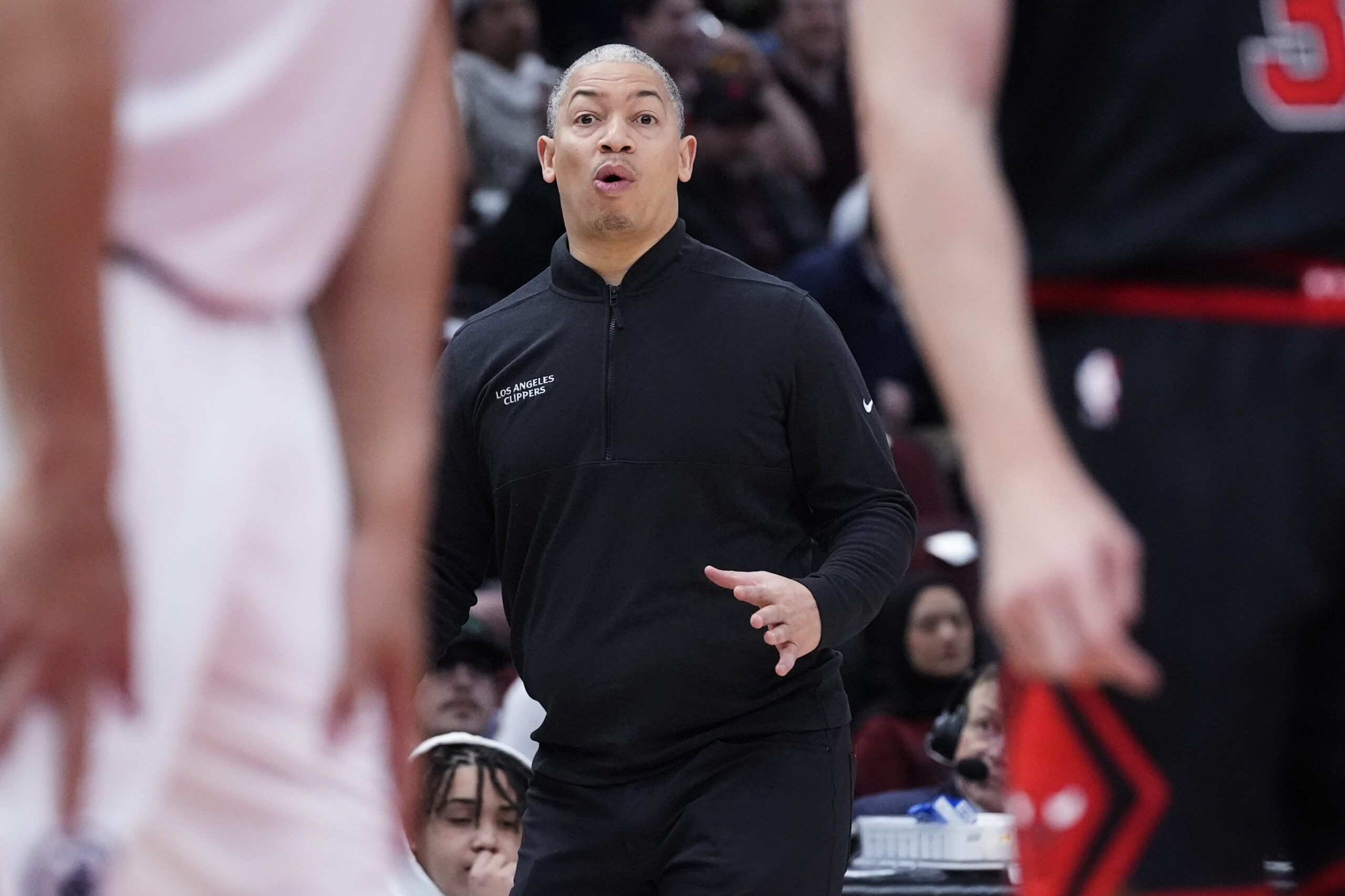 Clippers head coach Tyronn Lue reacts as he watches players...