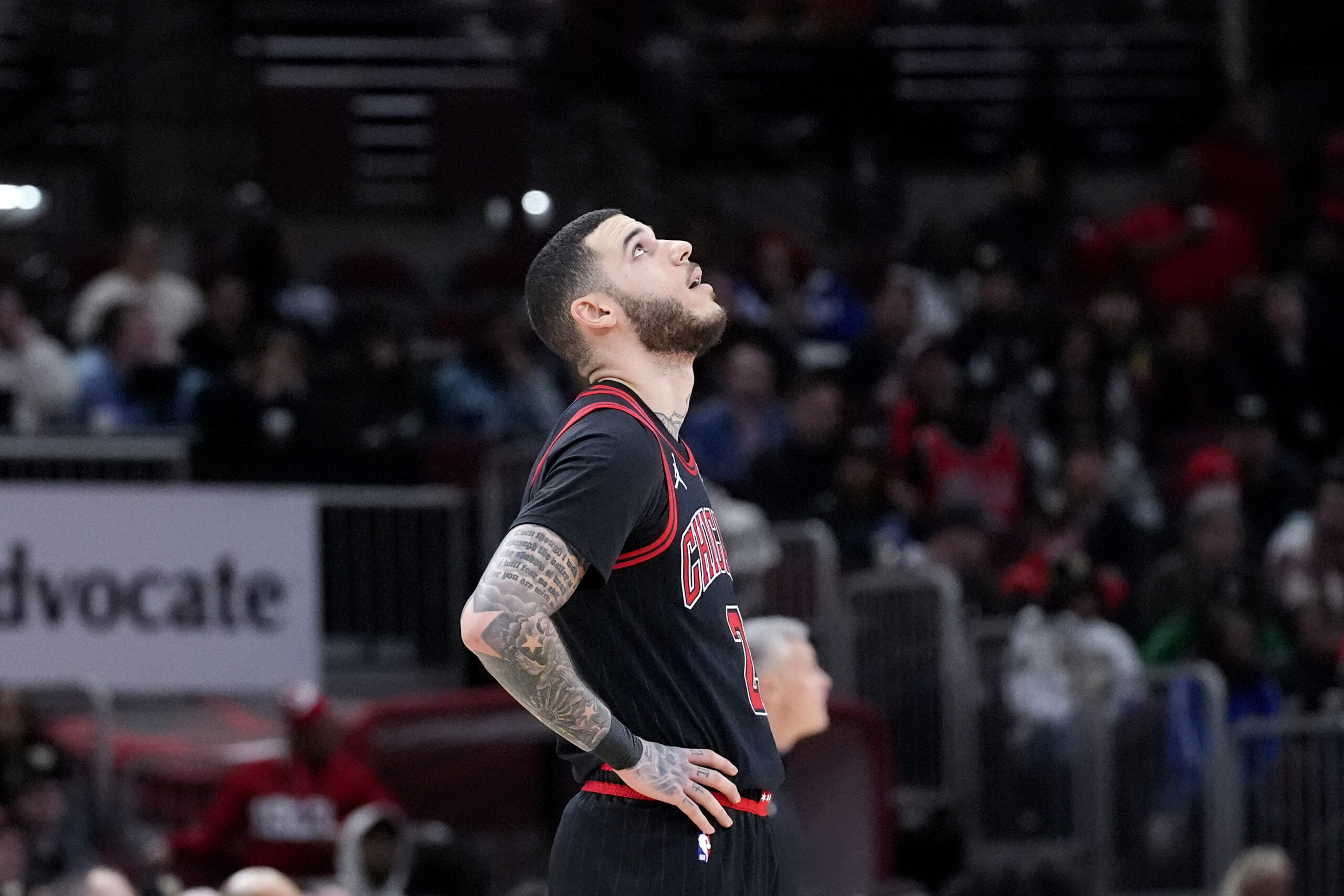 Chicago Bulls guard Lonzo Ball looks up the scoreboard during...