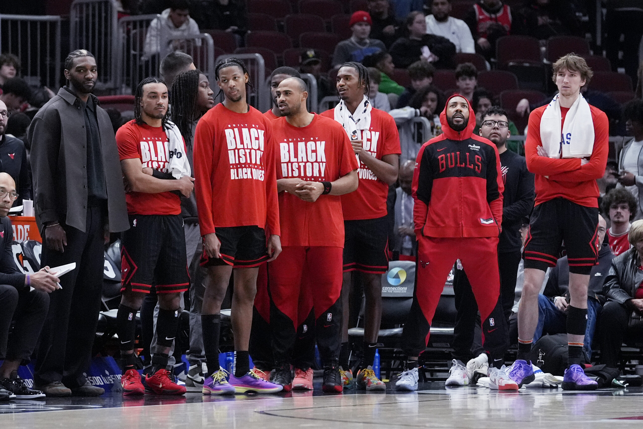 Chicago Bulls players watch teammates during the second half of...