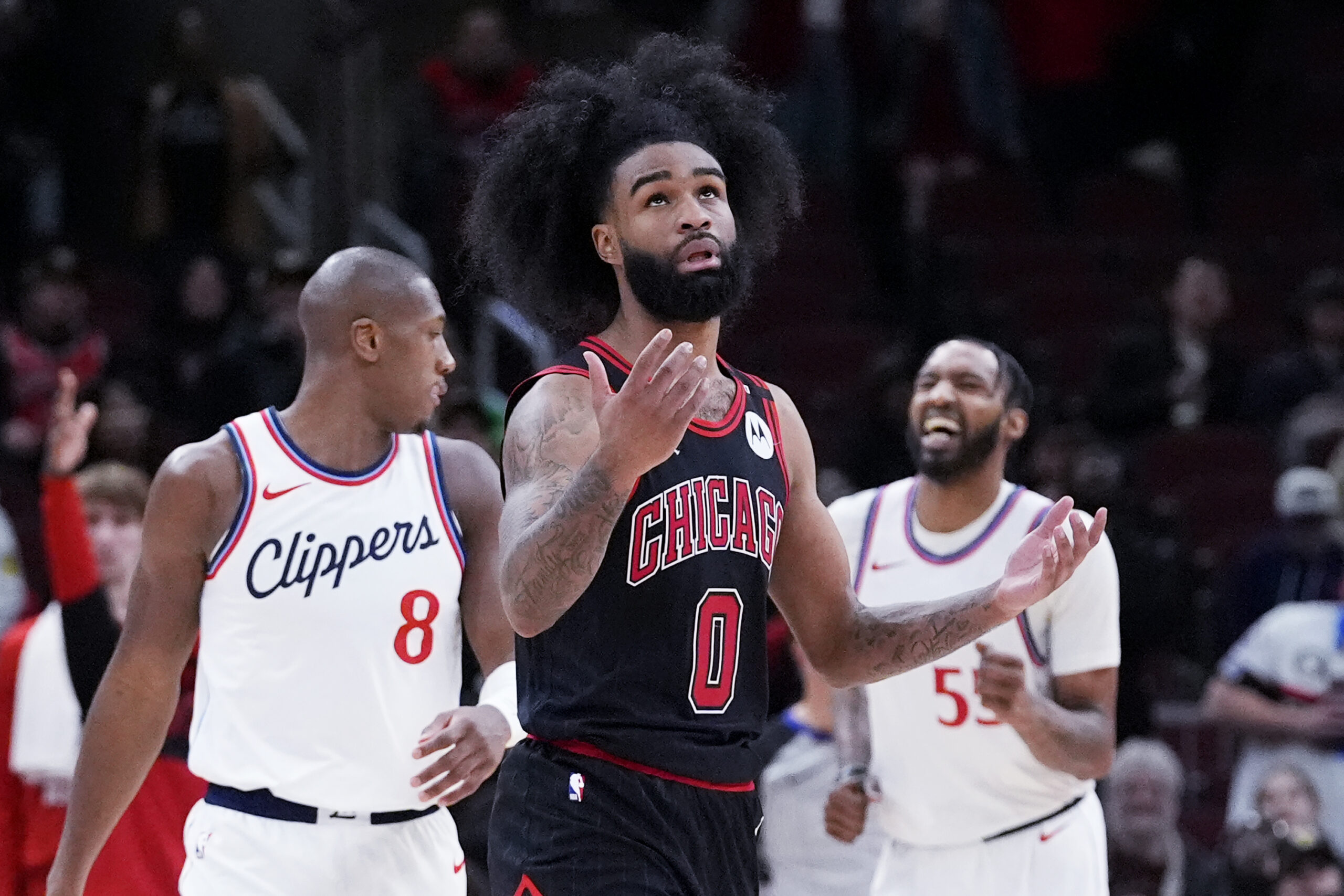 Chicago Bulls guard Coby White (0) reacts after making a...