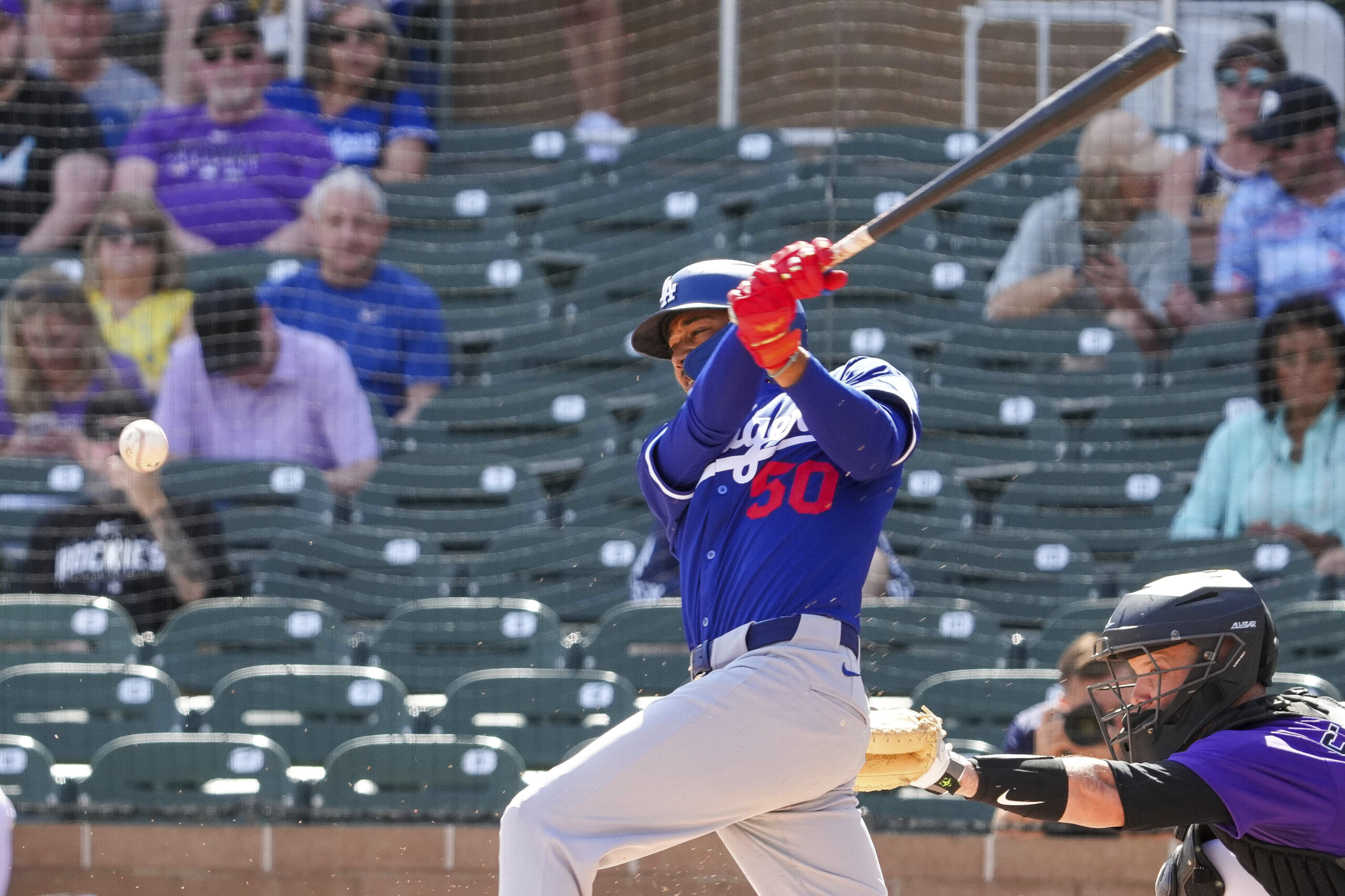 Dodgers star Mookie Betts follows through on a swing during...