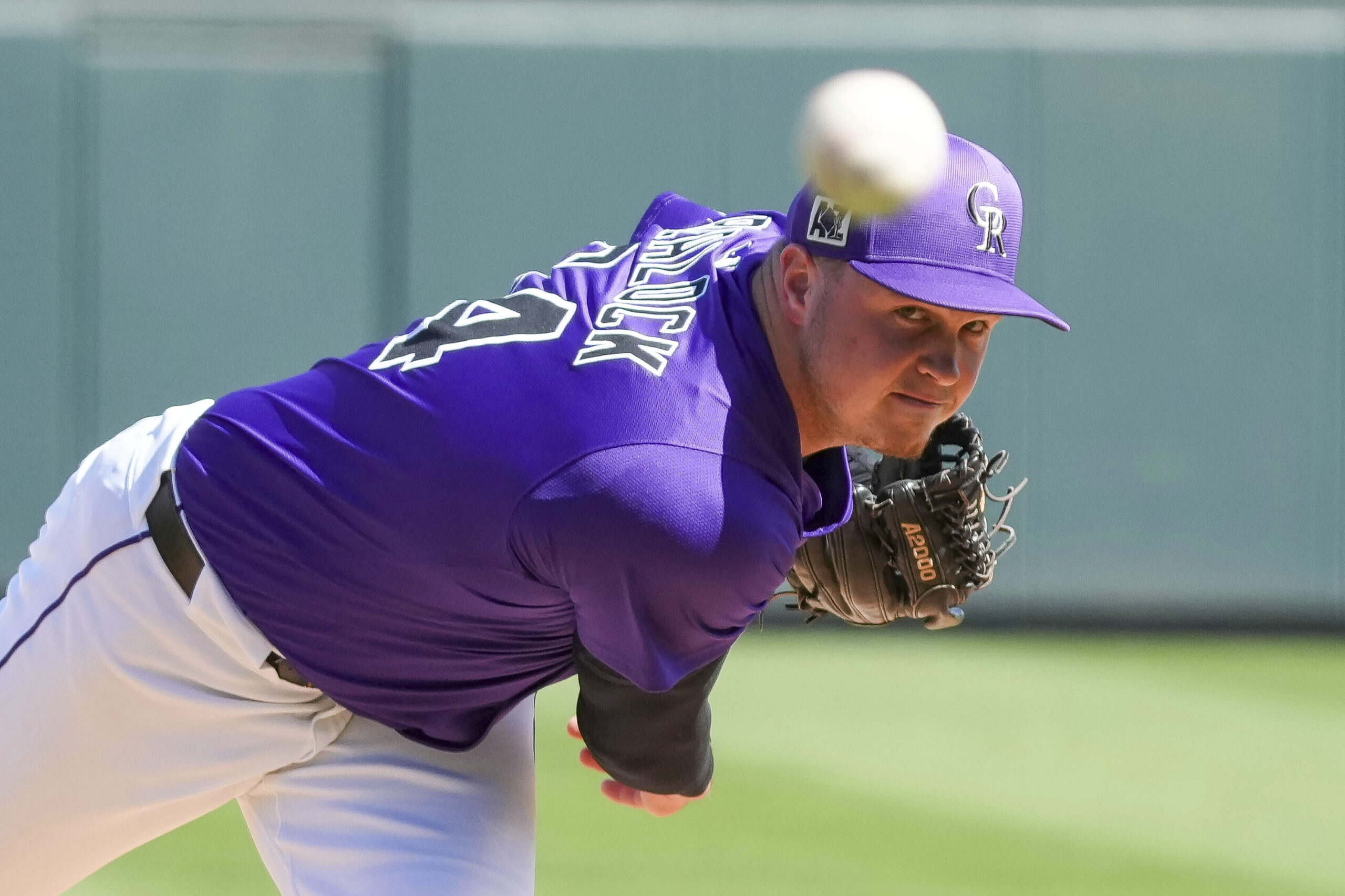 Colorado Rockies pitcher Bradley Blalock throws warm-up pitches before the...