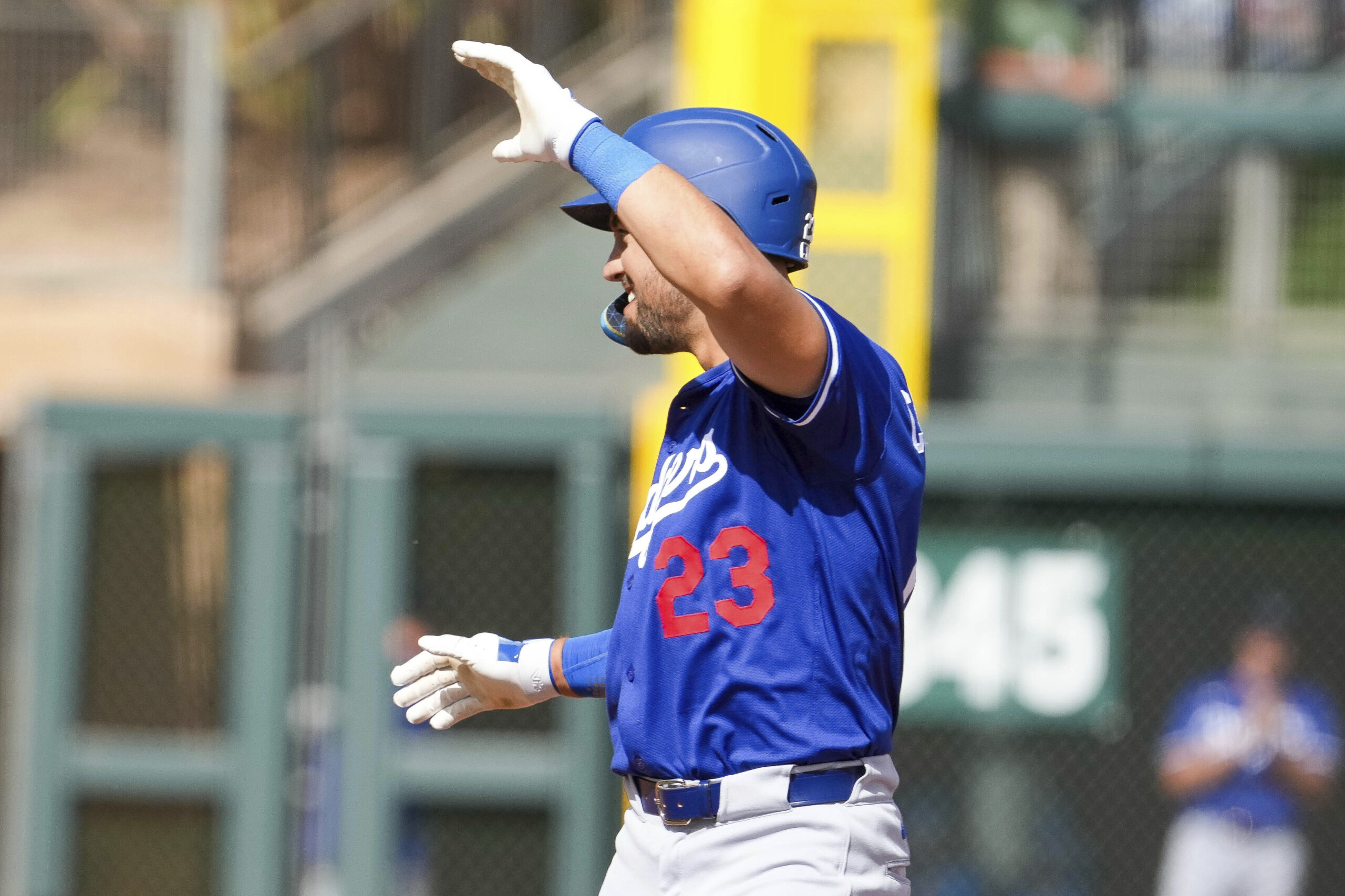 The Dodgers’ Michael Conforto celebrates hitting a double during the...