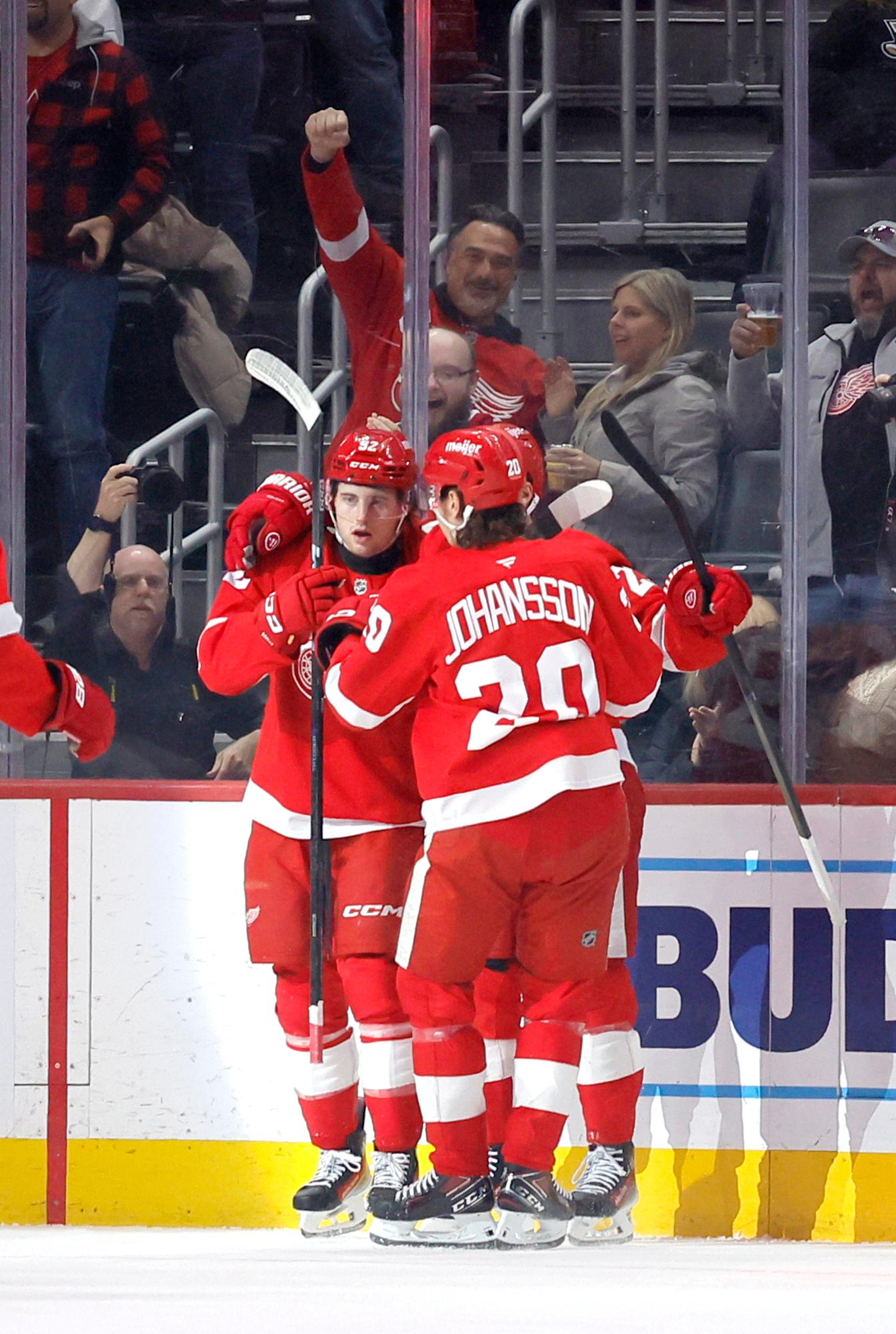 Detroit Red Wings center Marco Kasper (92) celebrates with defenseman...