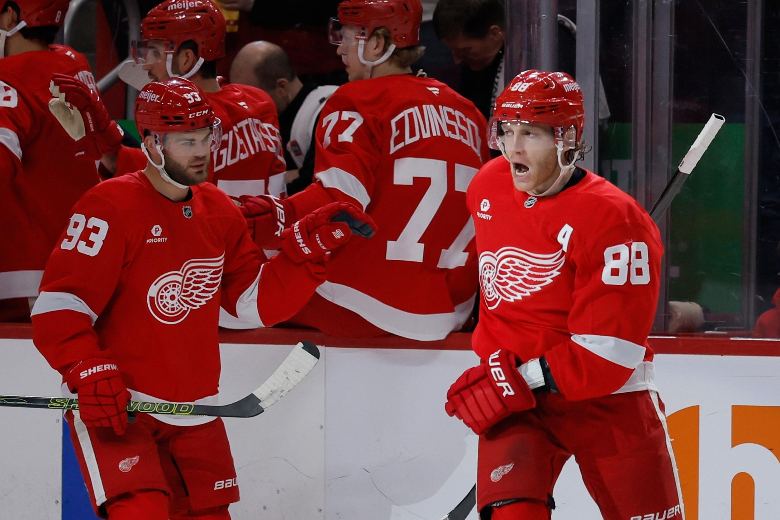 Detroit Red Wings right wing Patrick Kane (88) celebrates after...