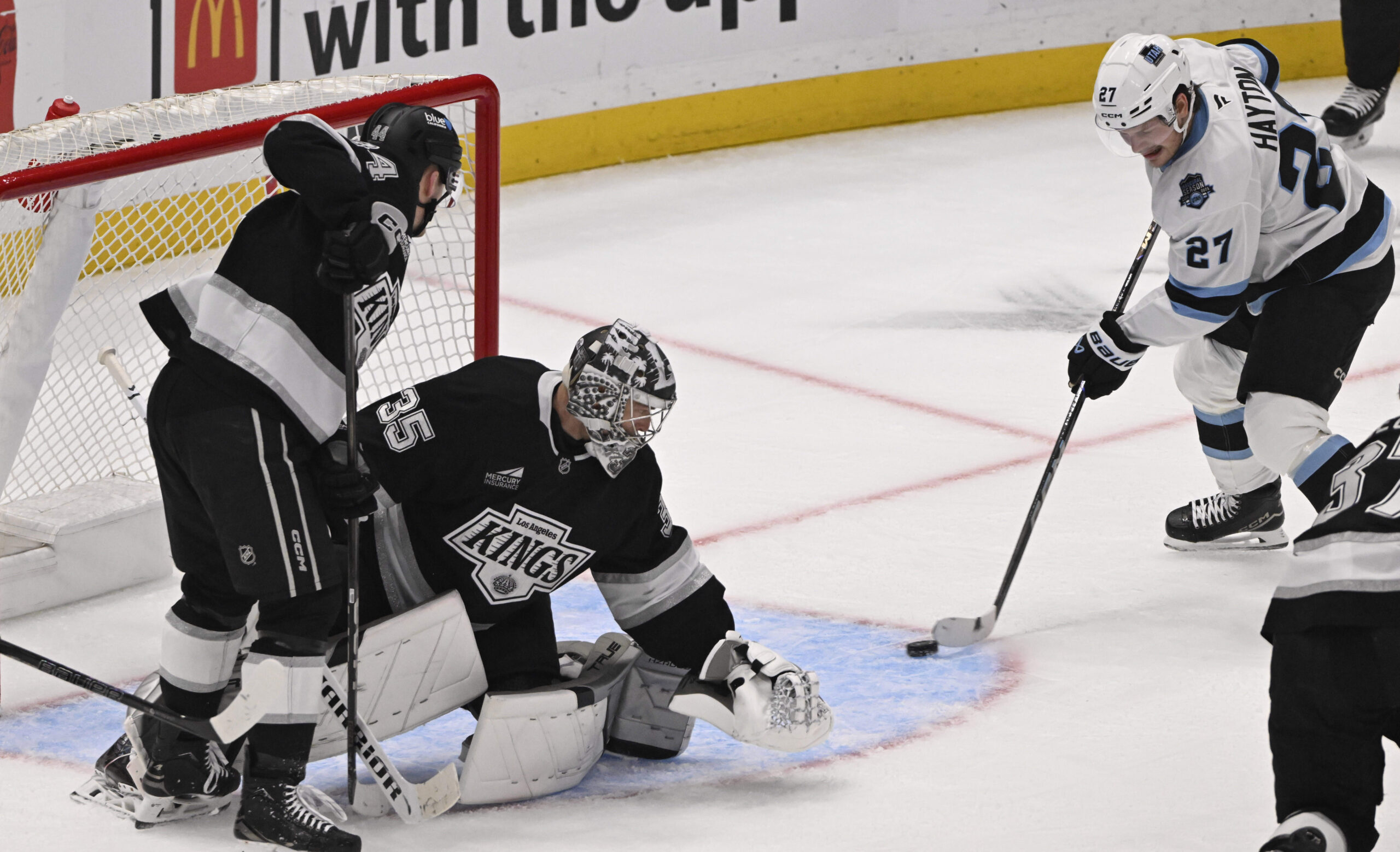 Barrett Hayton #27 of the Utah Hockey Club scores past...