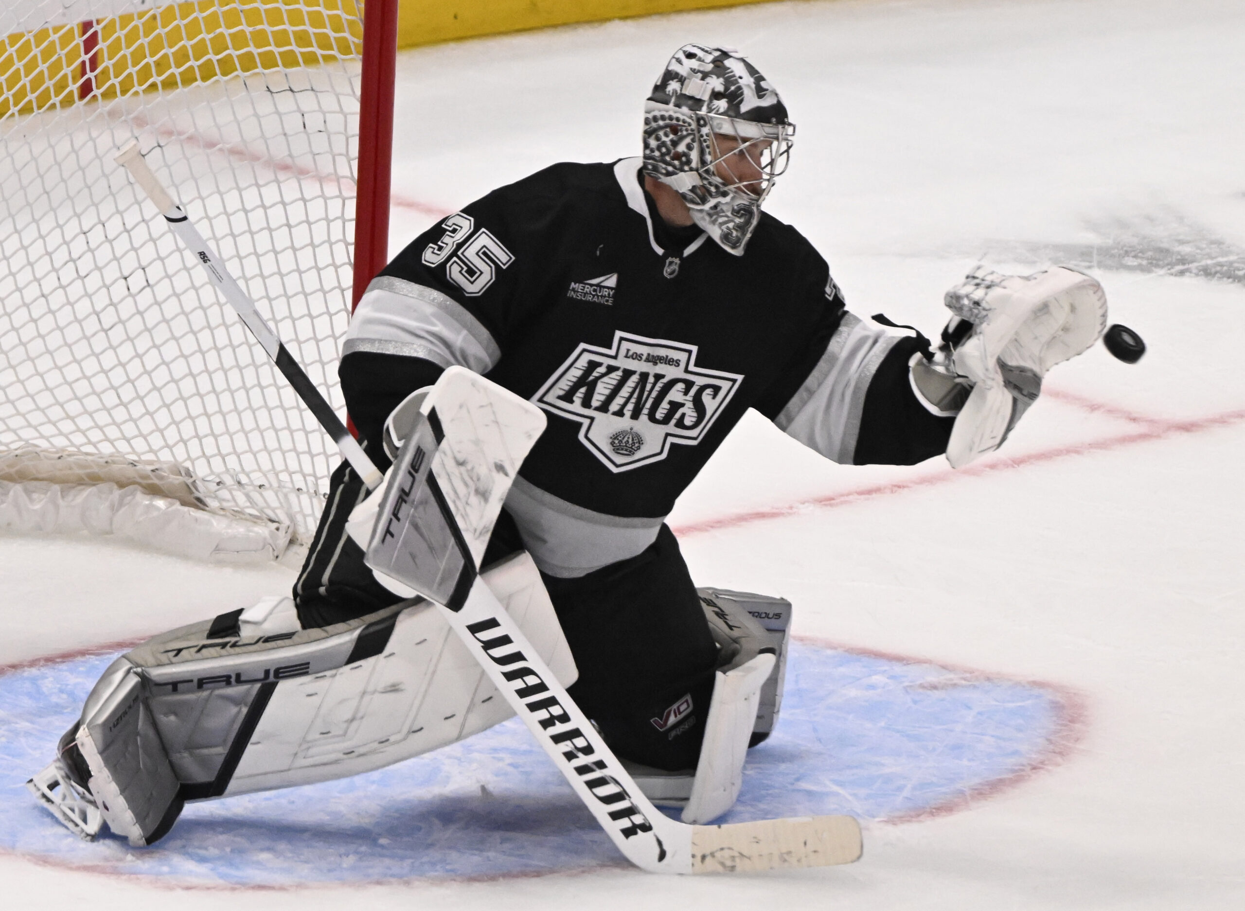 Goalie Darcy Kuemper #35 of the Kings blocks a shot...