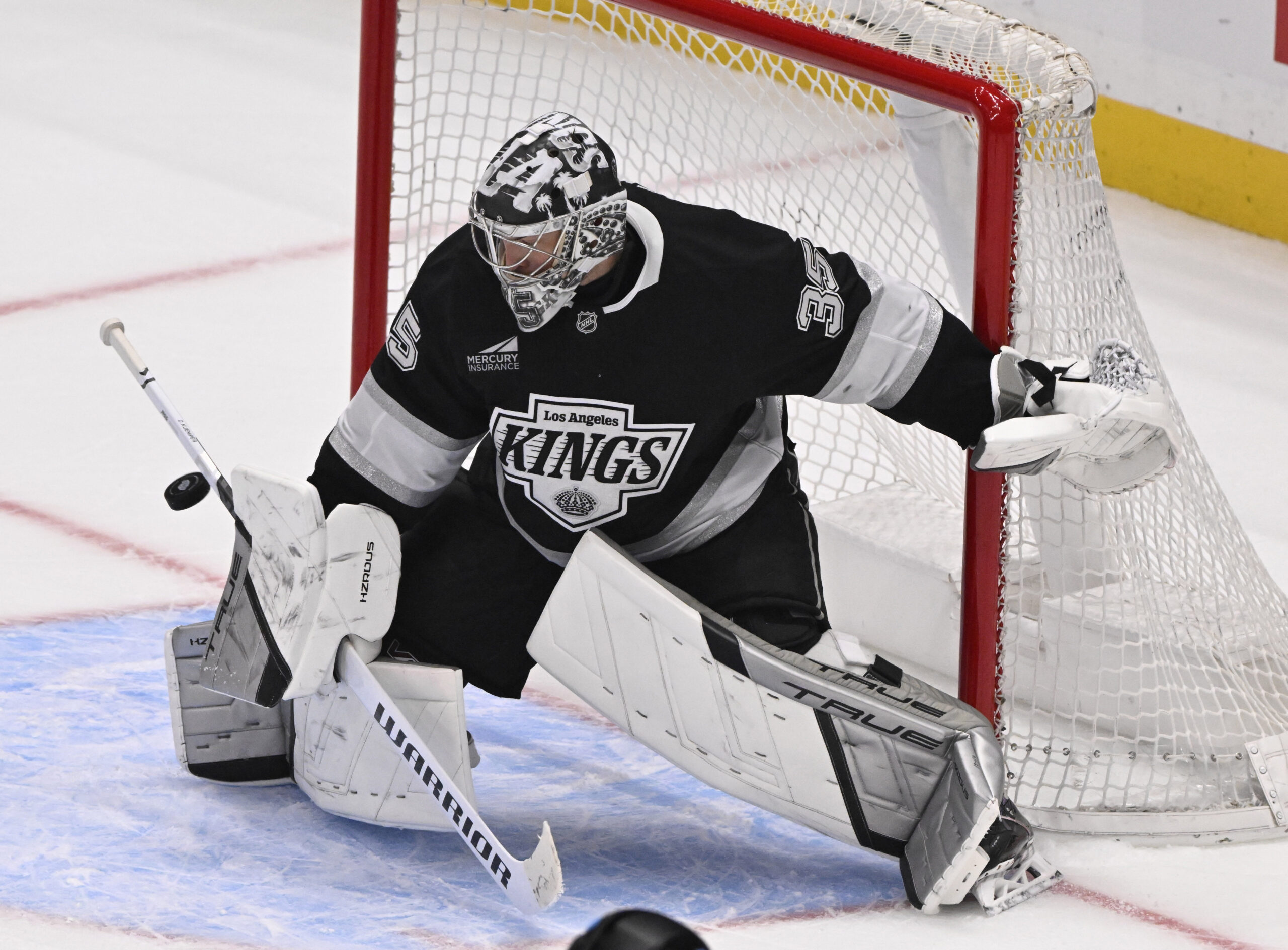 Goalie Darcy Kuemper #35 of the Kings blocks a shot...