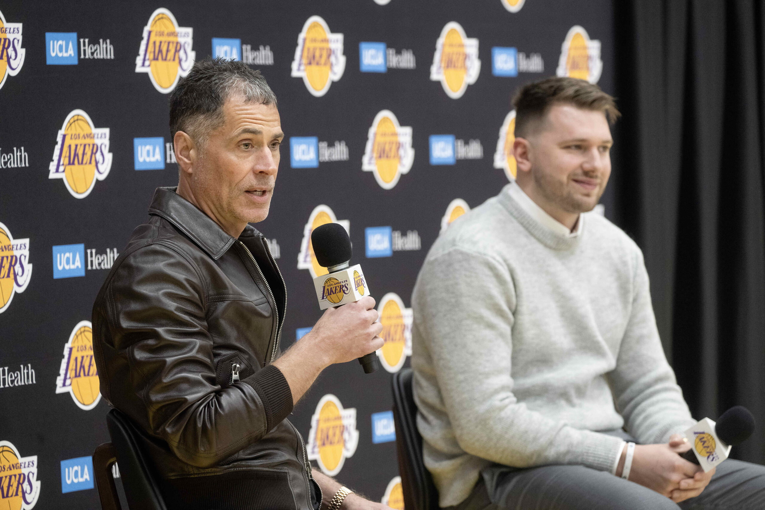 From left, Lakers general manager Rob Pelinka introduces Luka Doncic...