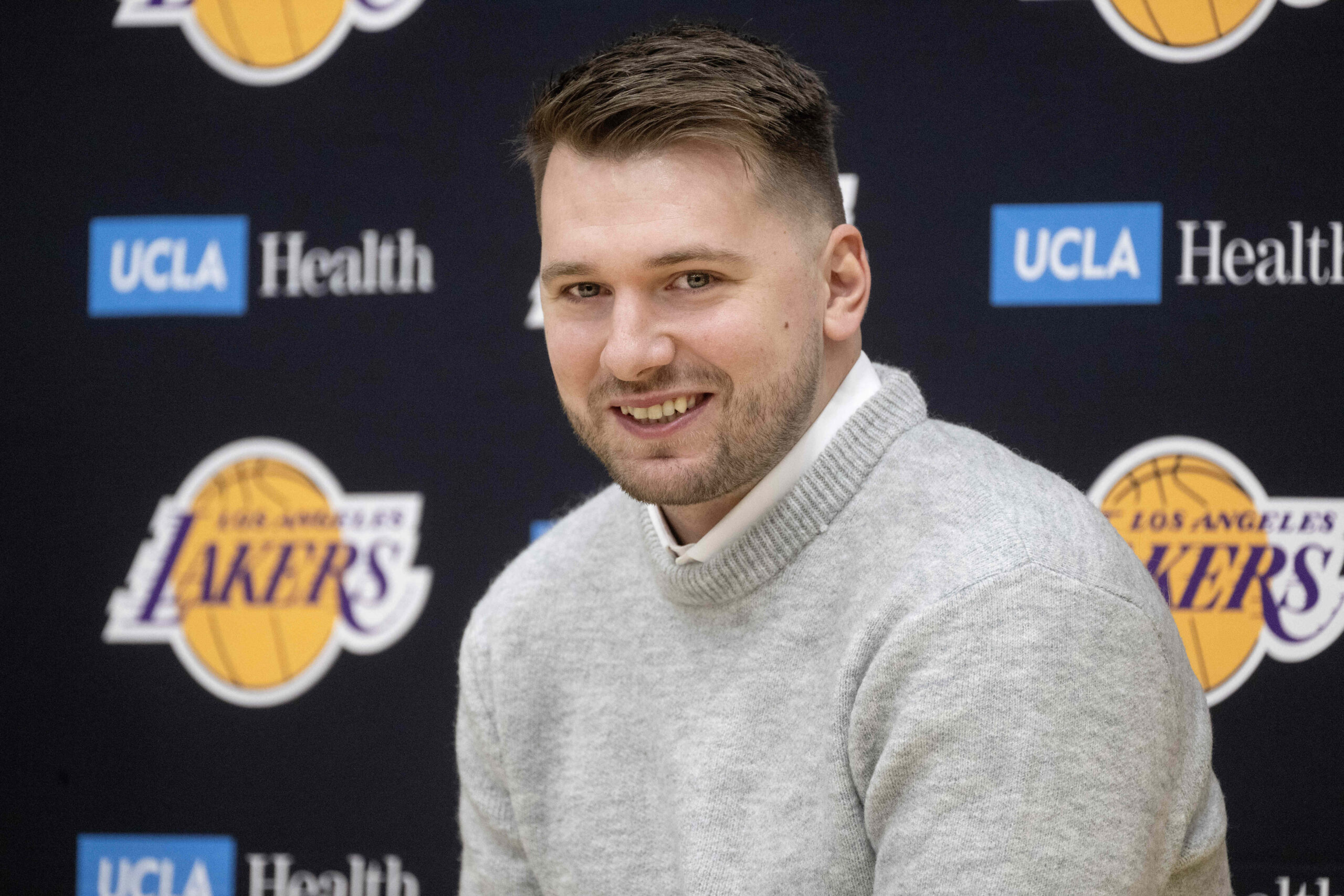 Lakers’ Luka Doncic smiles during a press conference at the...