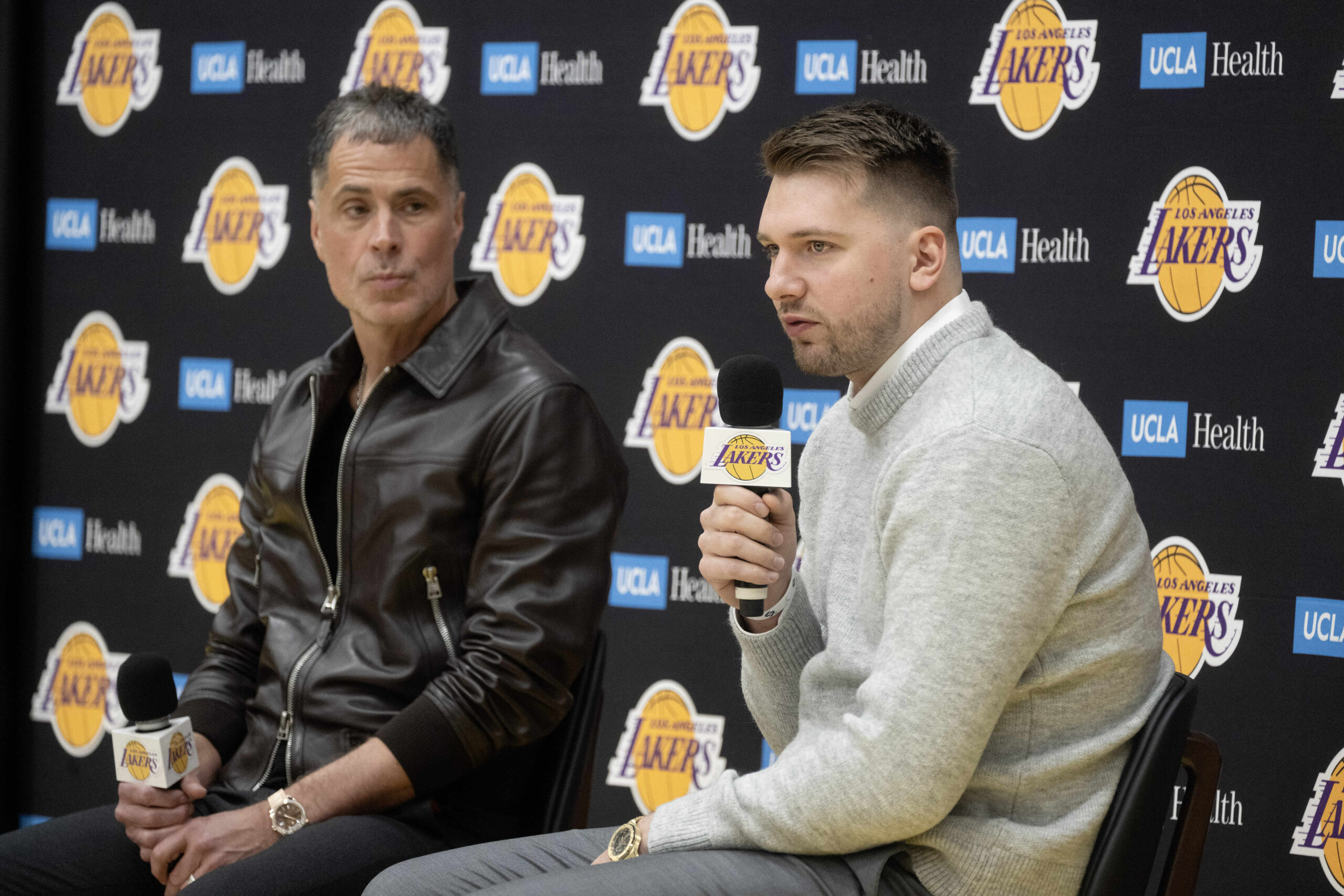 Lakers’ Luka Doncic, right, speaks during a press conference at...