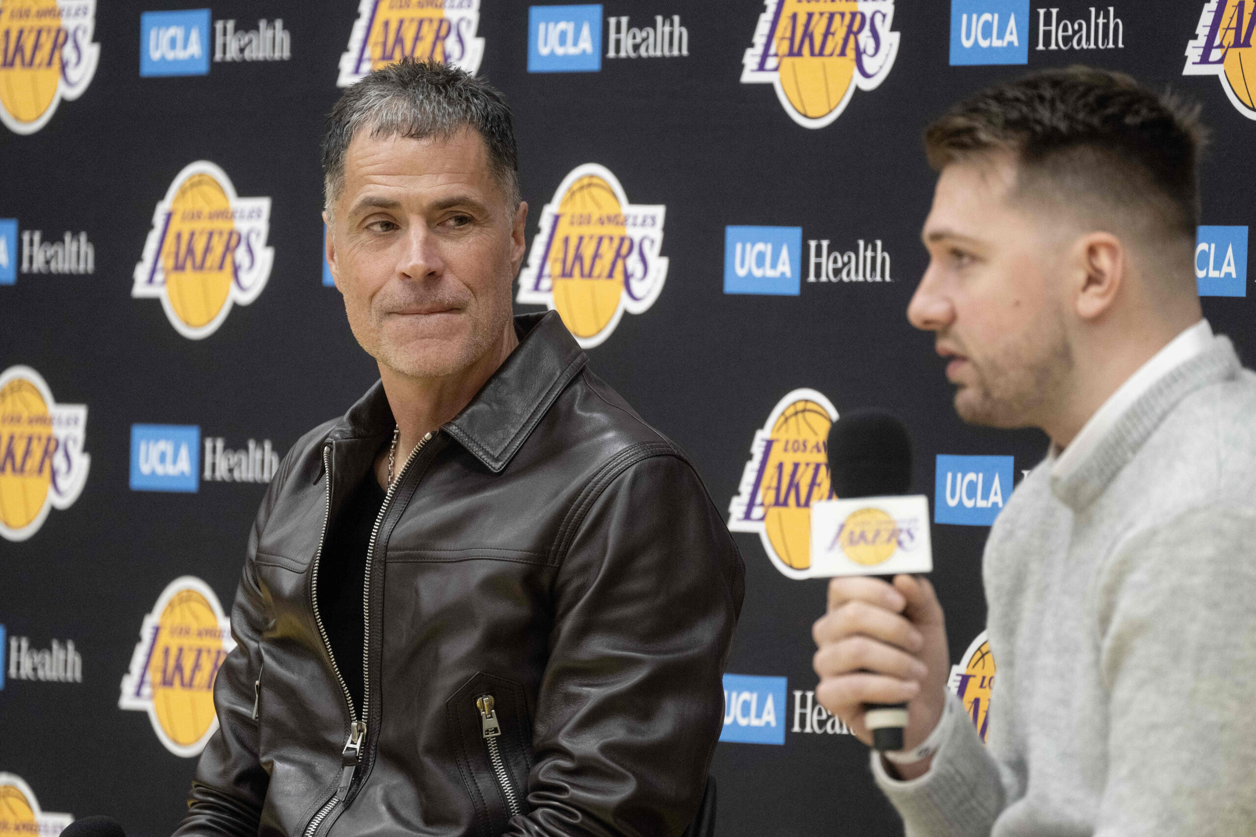 From left, Lakers general manager Rob Pelinka introduces Luka Doncic...