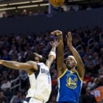 Feb 23, 2025; San Francisco, California, USA; Dallas Mavericks guard Kyrie Irving (11) defends against a shot by Golden State Warriors forward Jimmy Butler III (10) during the fourth quarter at Chase Center. Mandatory Credit: John Hefti-Imagn Images