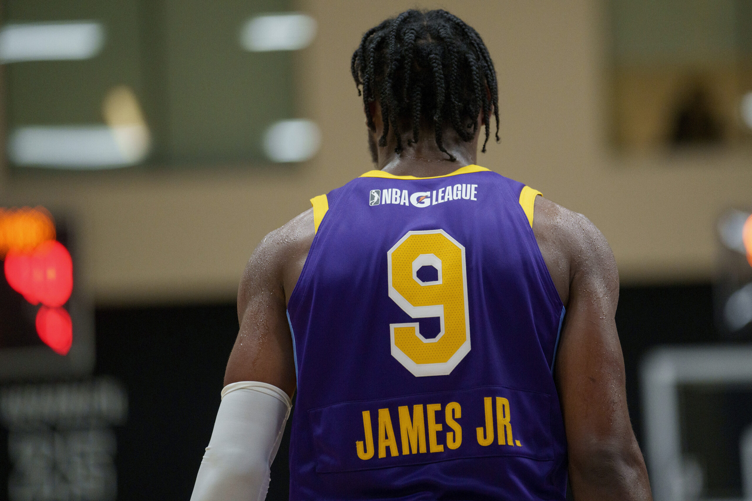 South Bay Lakers guard Bronny James walks on the court...