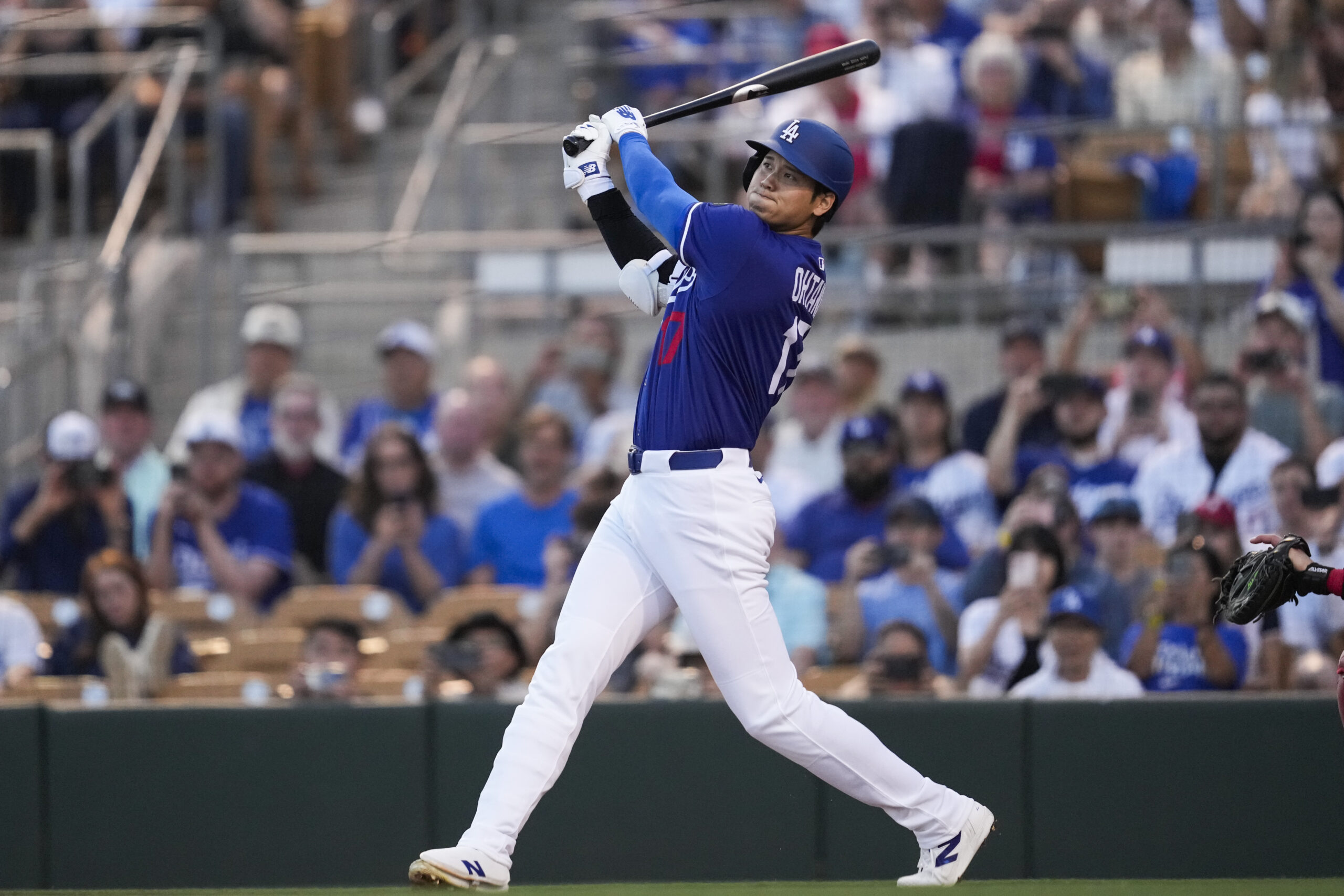 Dodgers designated hitter Shohei Ohtani hits a home run during...