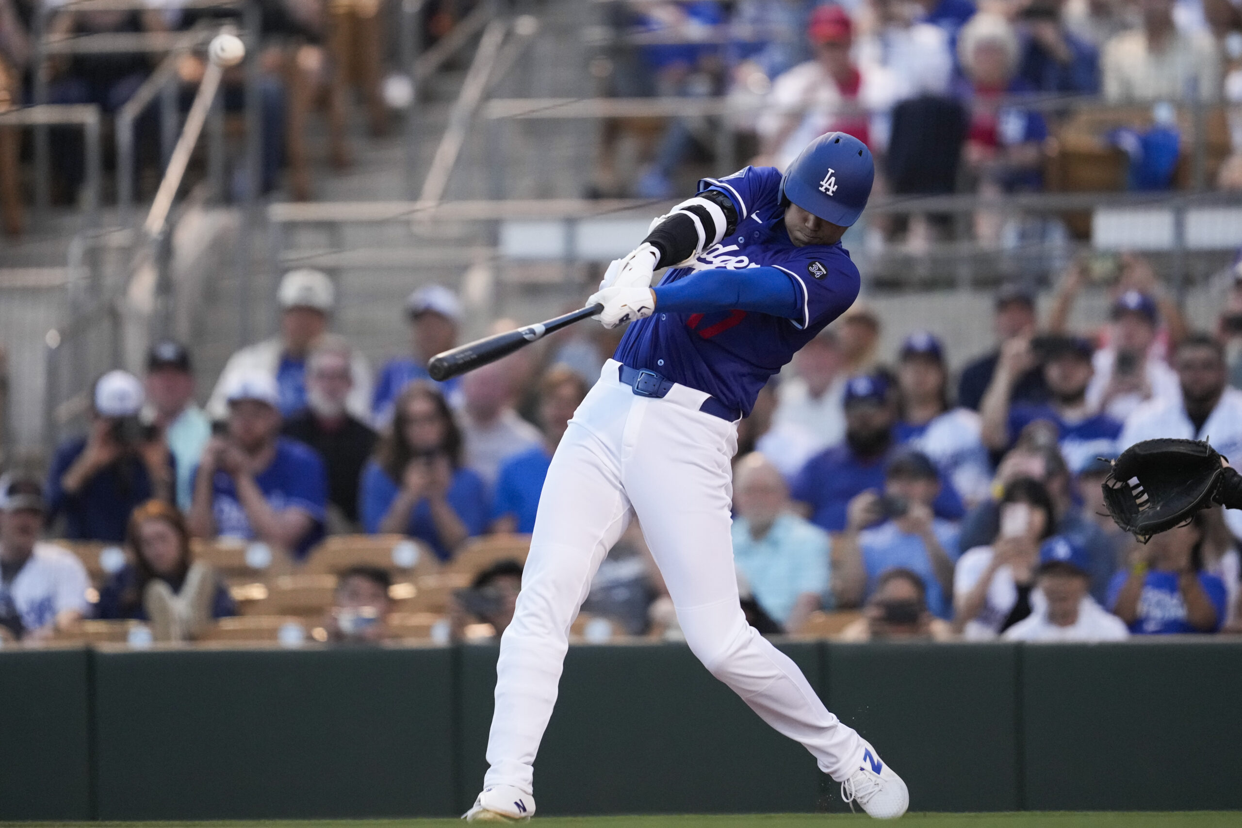 Dodgers designated hitter Shohei Ohtani hits a home run during...