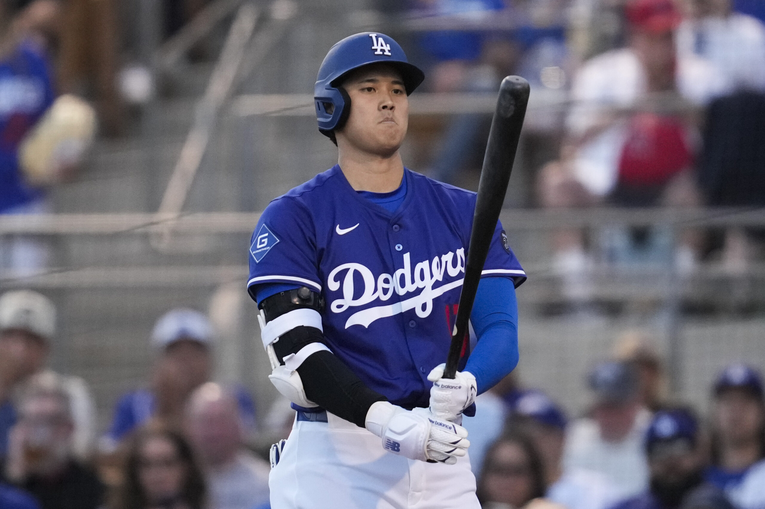 Dodgers designated hitter Shohei Ohtani prepares to bat during the...