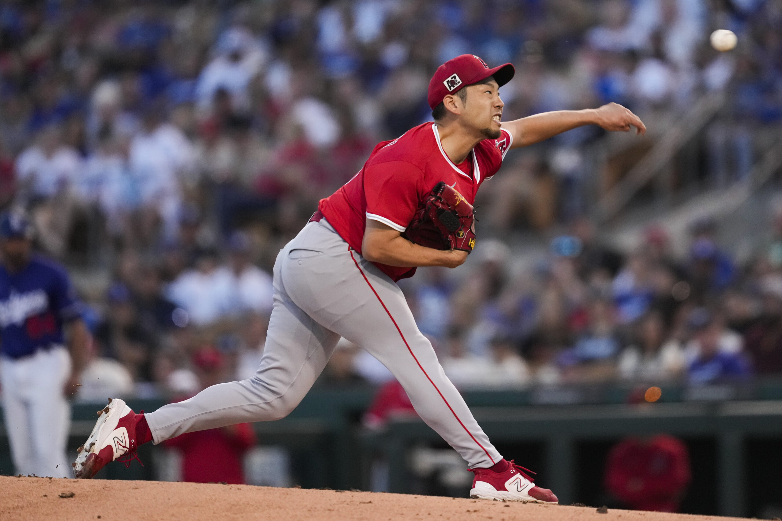 Angels starting pitcher Yusei Kikuchi throws during the first inning...