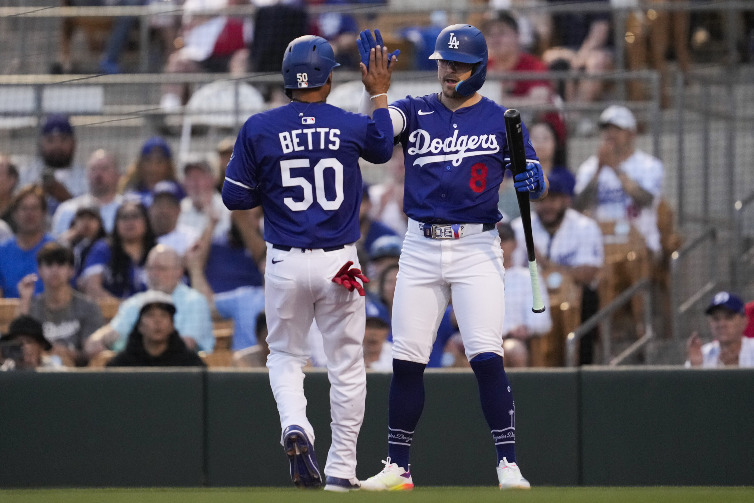 The Dodgers’ Mookie Betts (50) celebrates with Kiké Hernandez (8)...