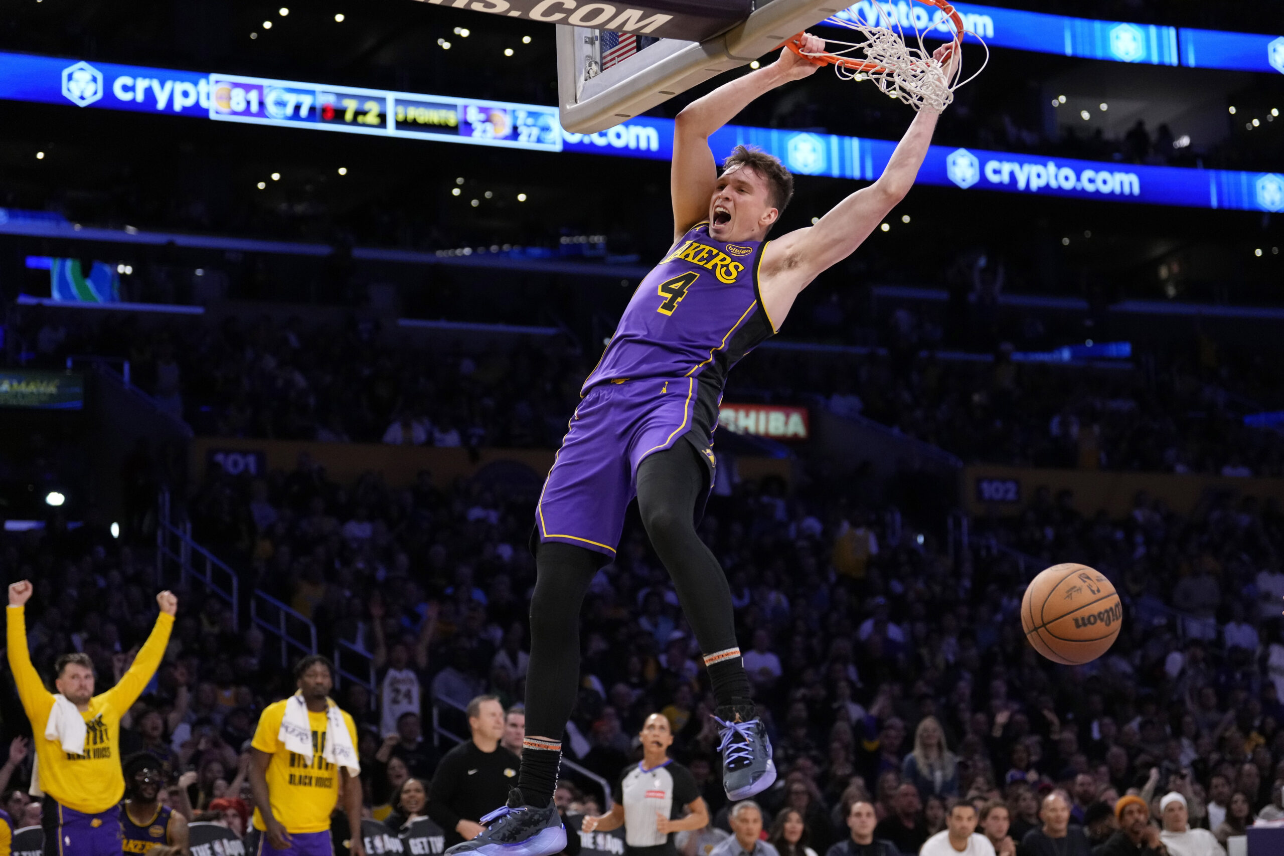 Lakers guard Dalton Knecht dunks during the second half of...