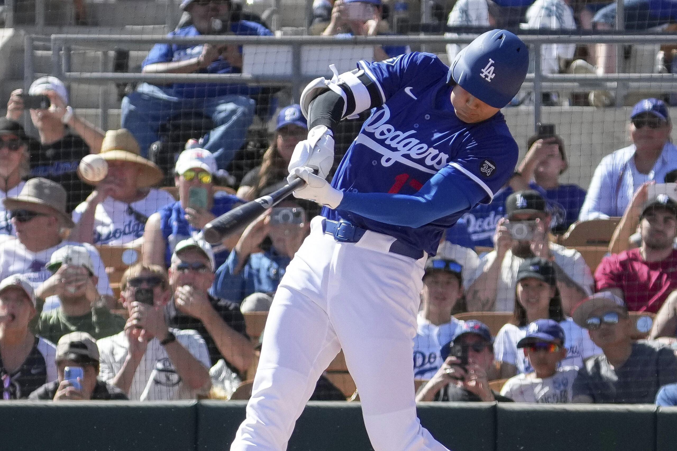 Dodgers two-way player Shohei Ohtani hits a single during the...