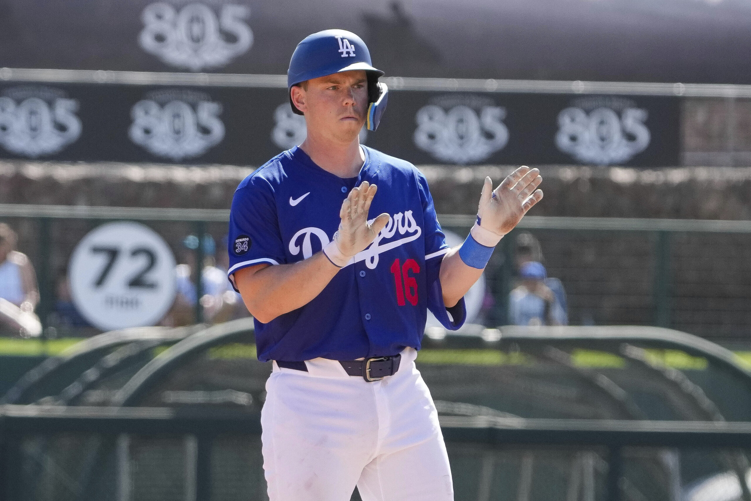 Dodgers catcher Will Smith gestures after hitting a double during...