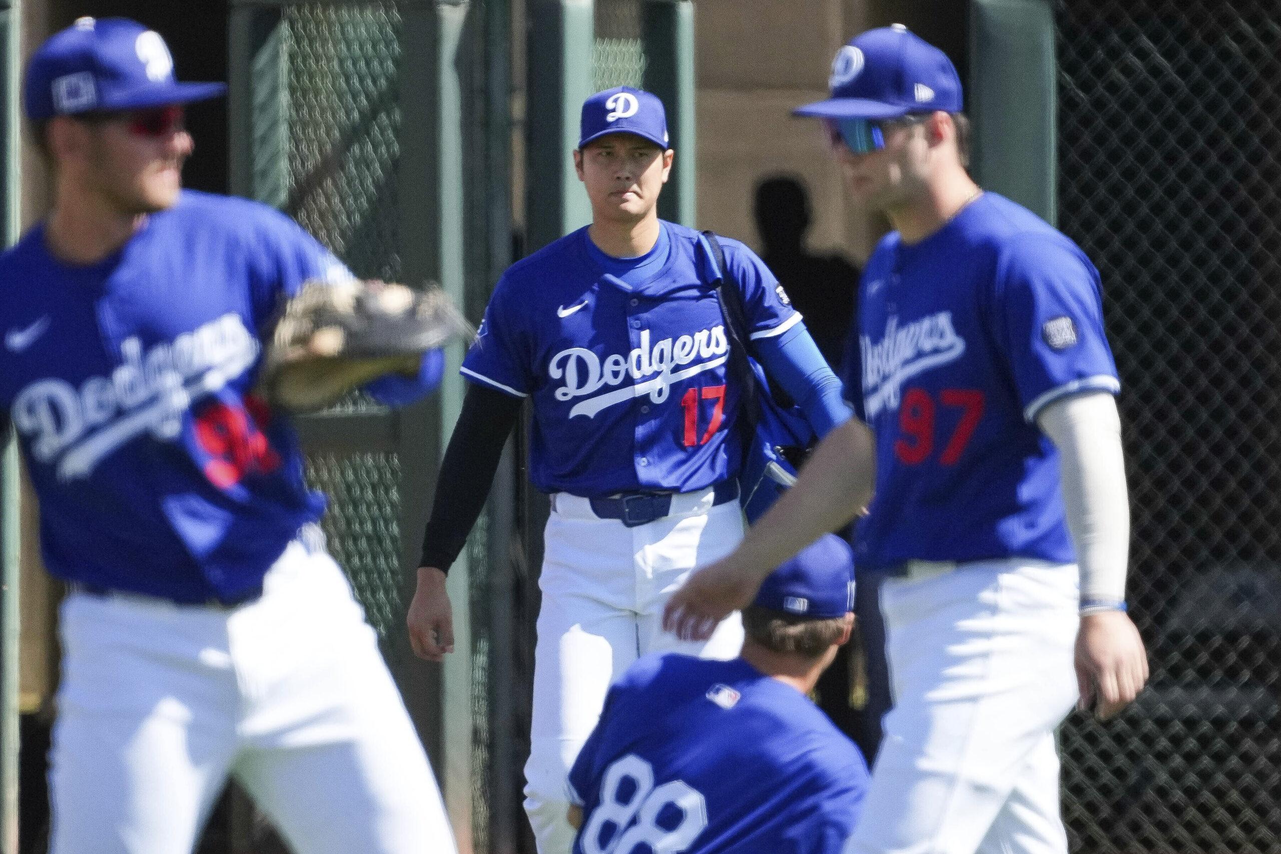 Dodgers two-way player Shohei Ohtani (17) makes his way onto...