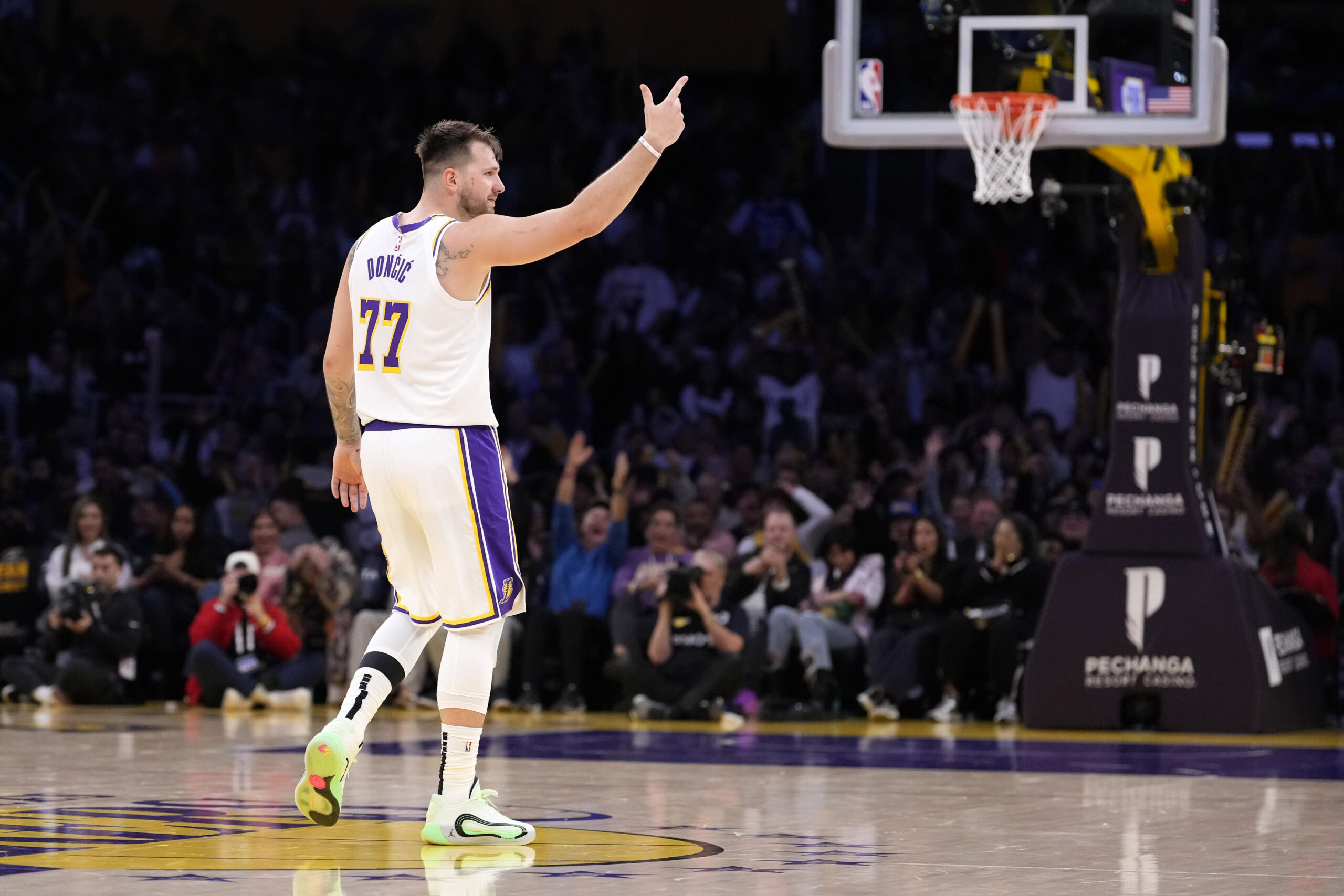 Lakers guard Luka Doncic gestures after scoring during the second...