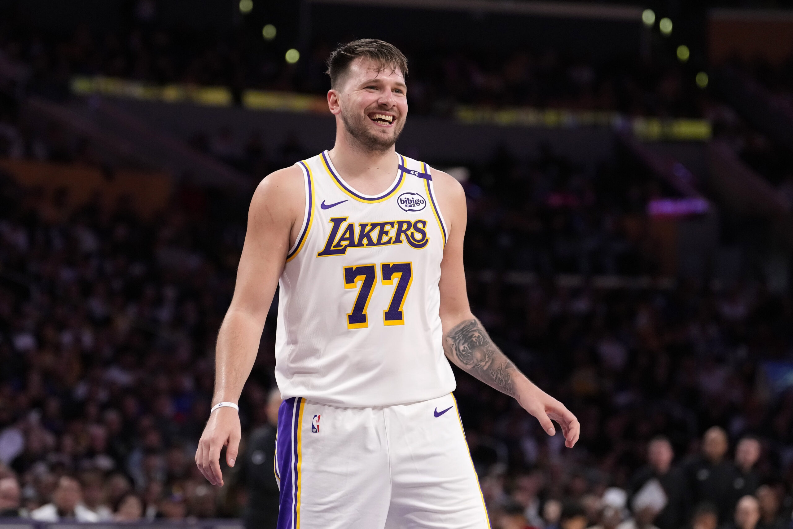 Lakers guard Luka Doncic smiles during the second half of...