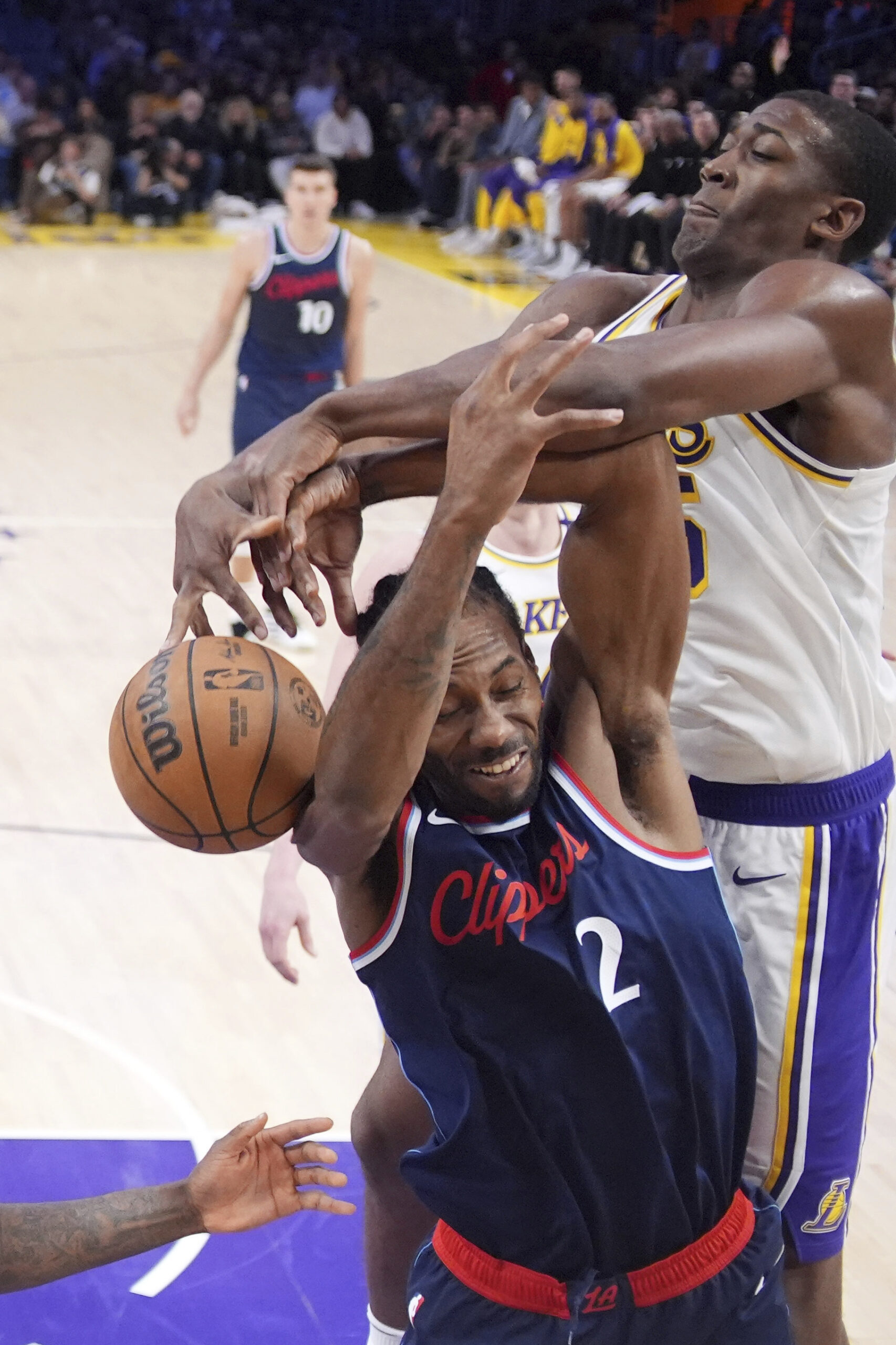 Lakers center Trey Jemison III, right, blocks the shot of...