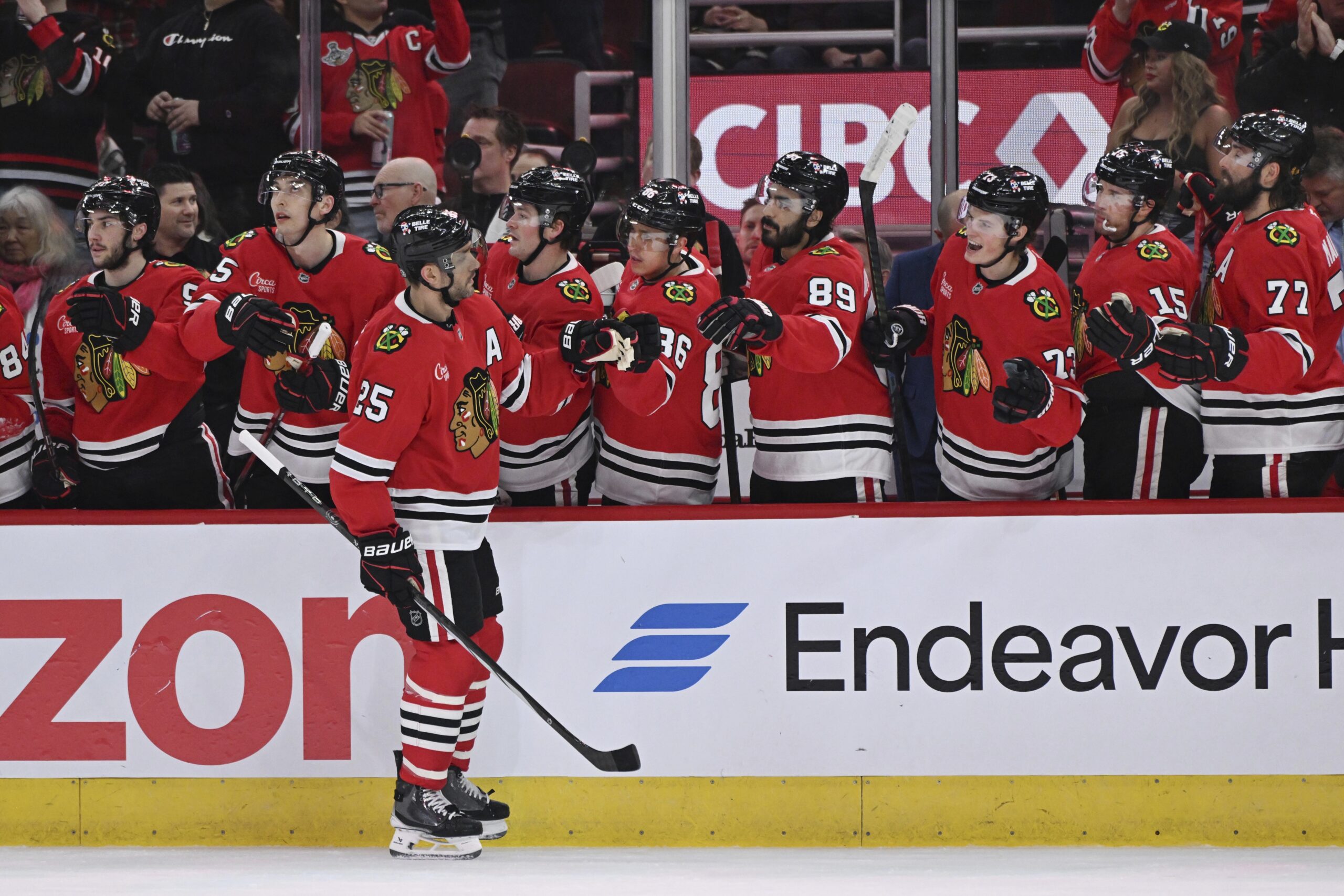 The Chicago Blackhawks’ Alec Martinez (25) celebrates with teammates at...