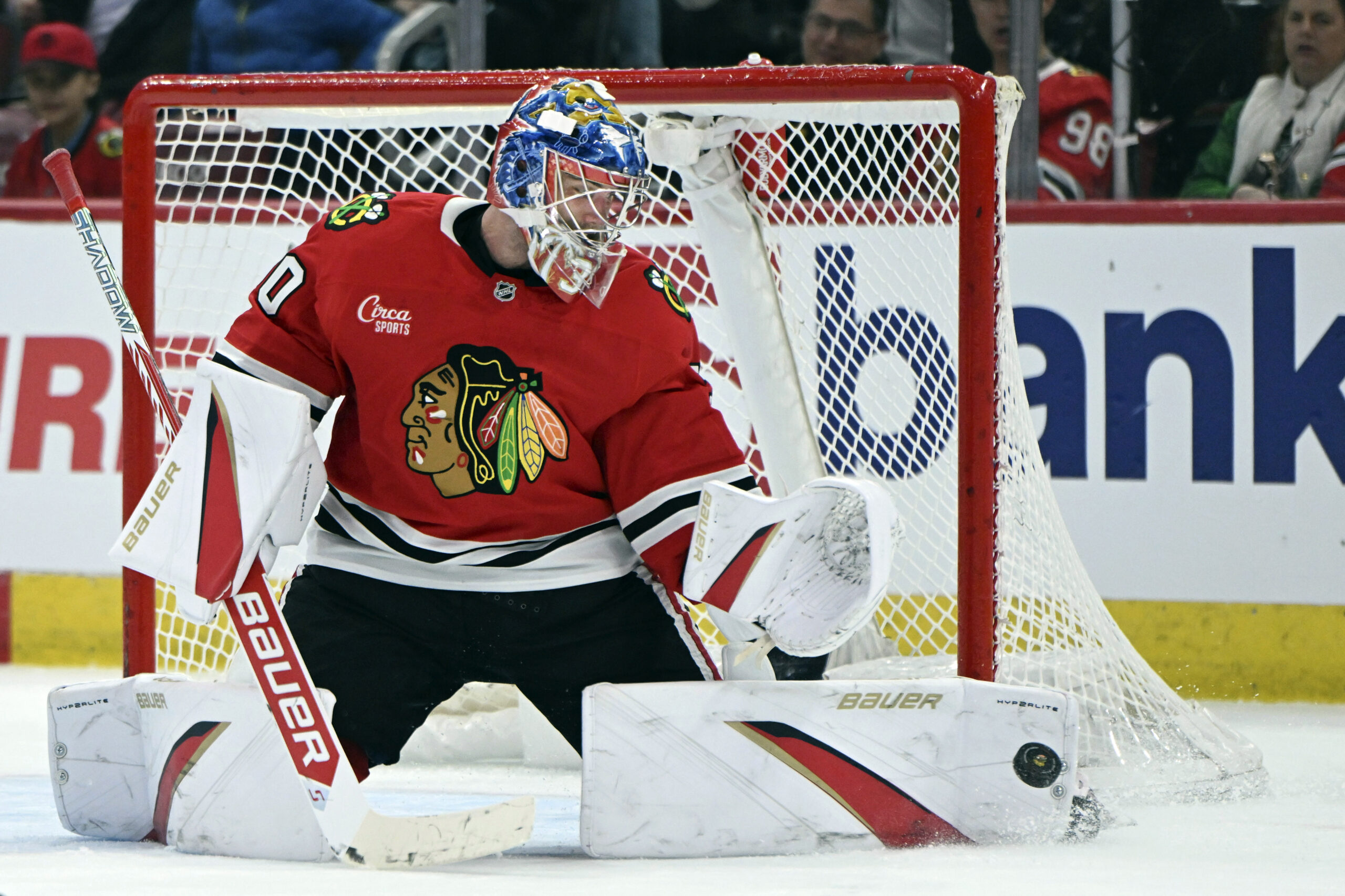 Chicago Blackhawks goalie Spencer Knight makes a save during the...