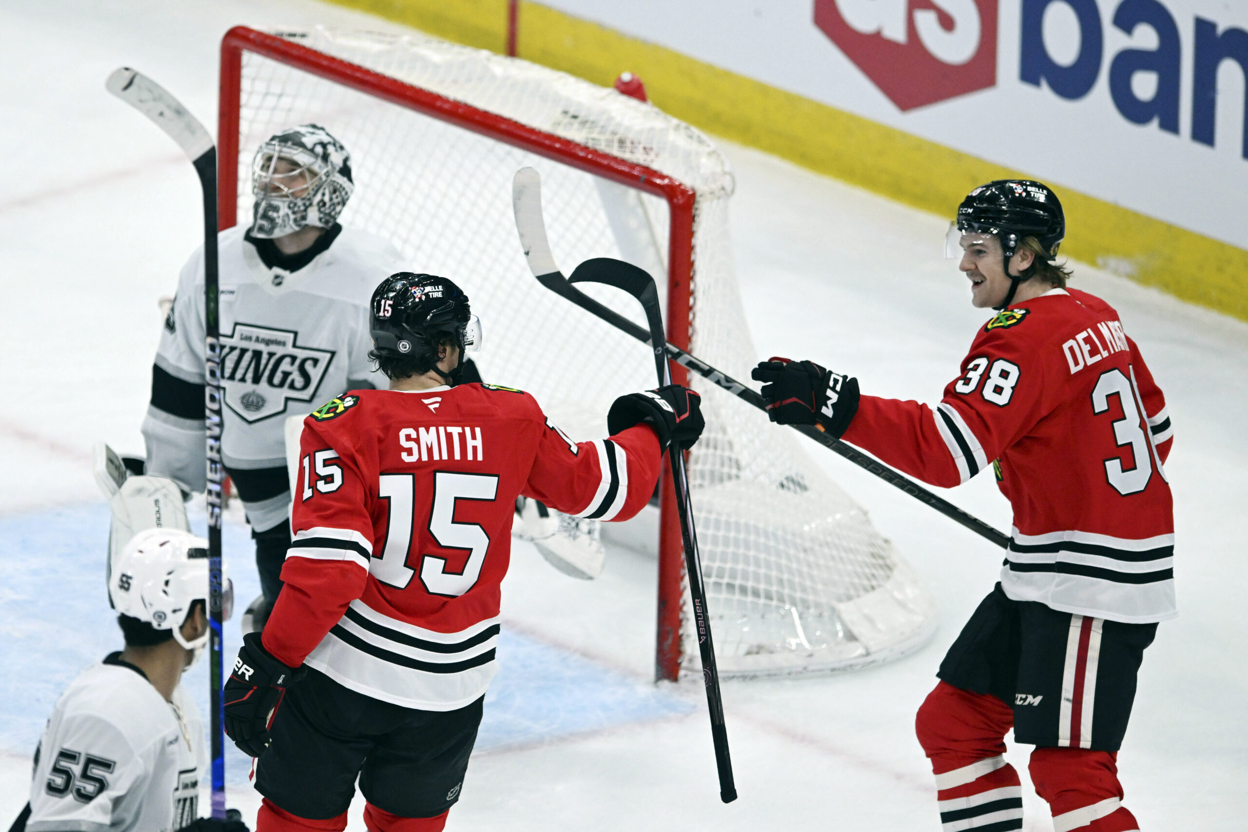 The Chicago Blackhawks’ Ethan Del Mastro (38) celebrates with teammate...