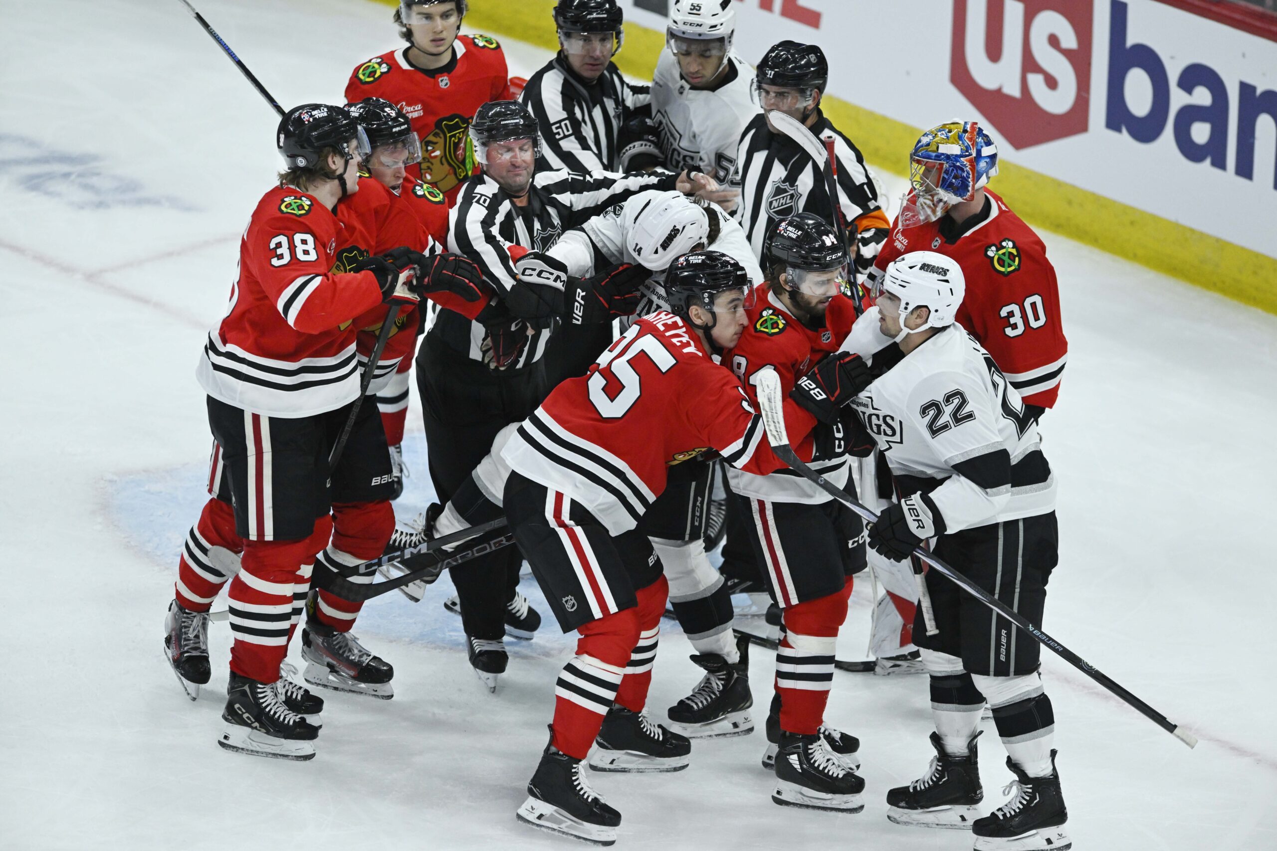 Chicago Blackhawks players and Kings players tussle during the third...