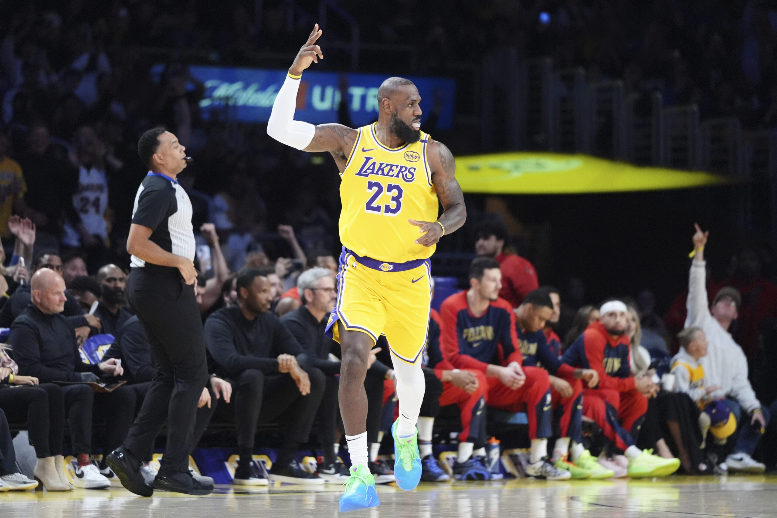 Lakers star LeBron James gestures after making a 3-point shot...