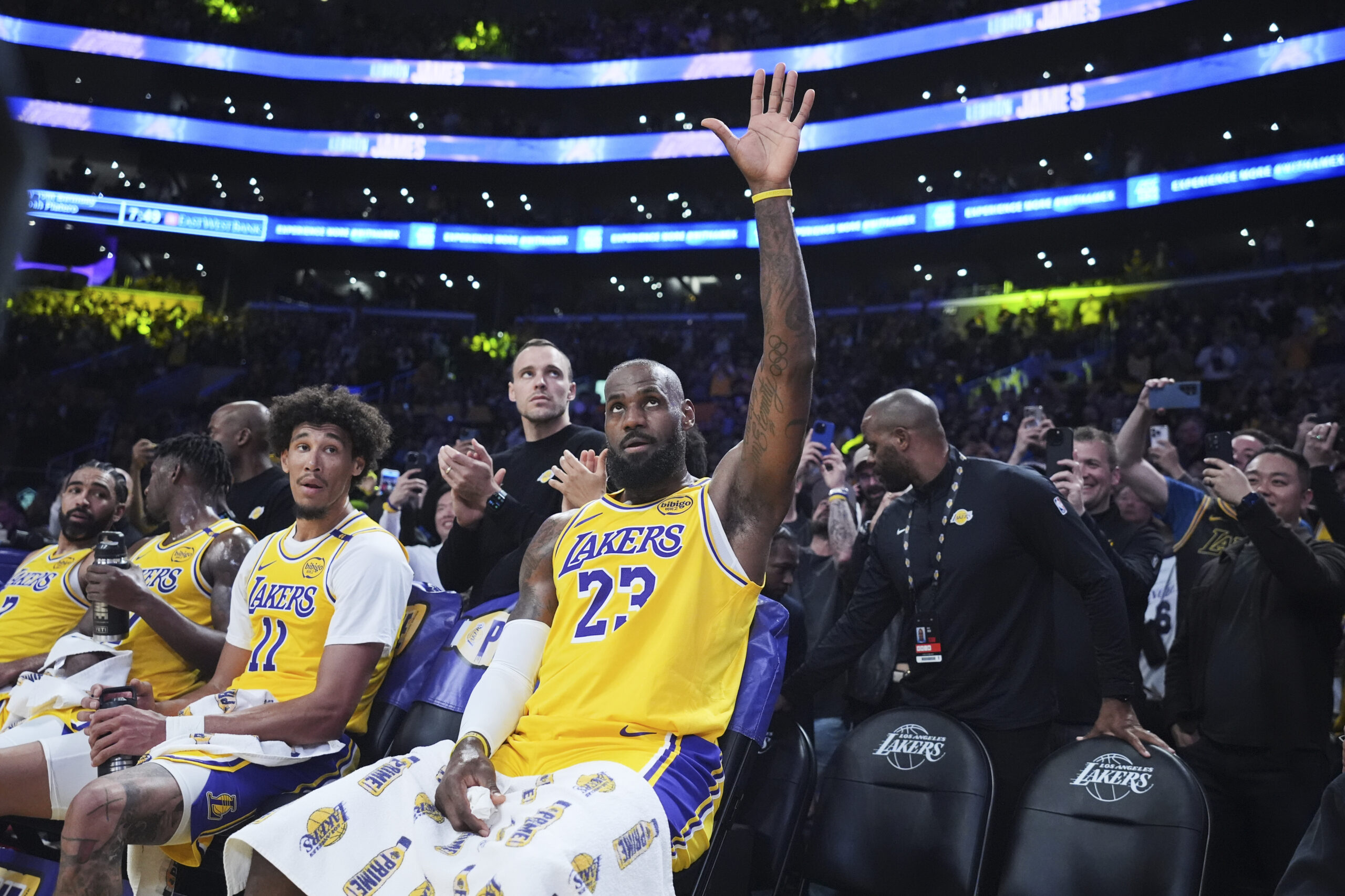 Lakers star LeBron James waves the crowd after making a...