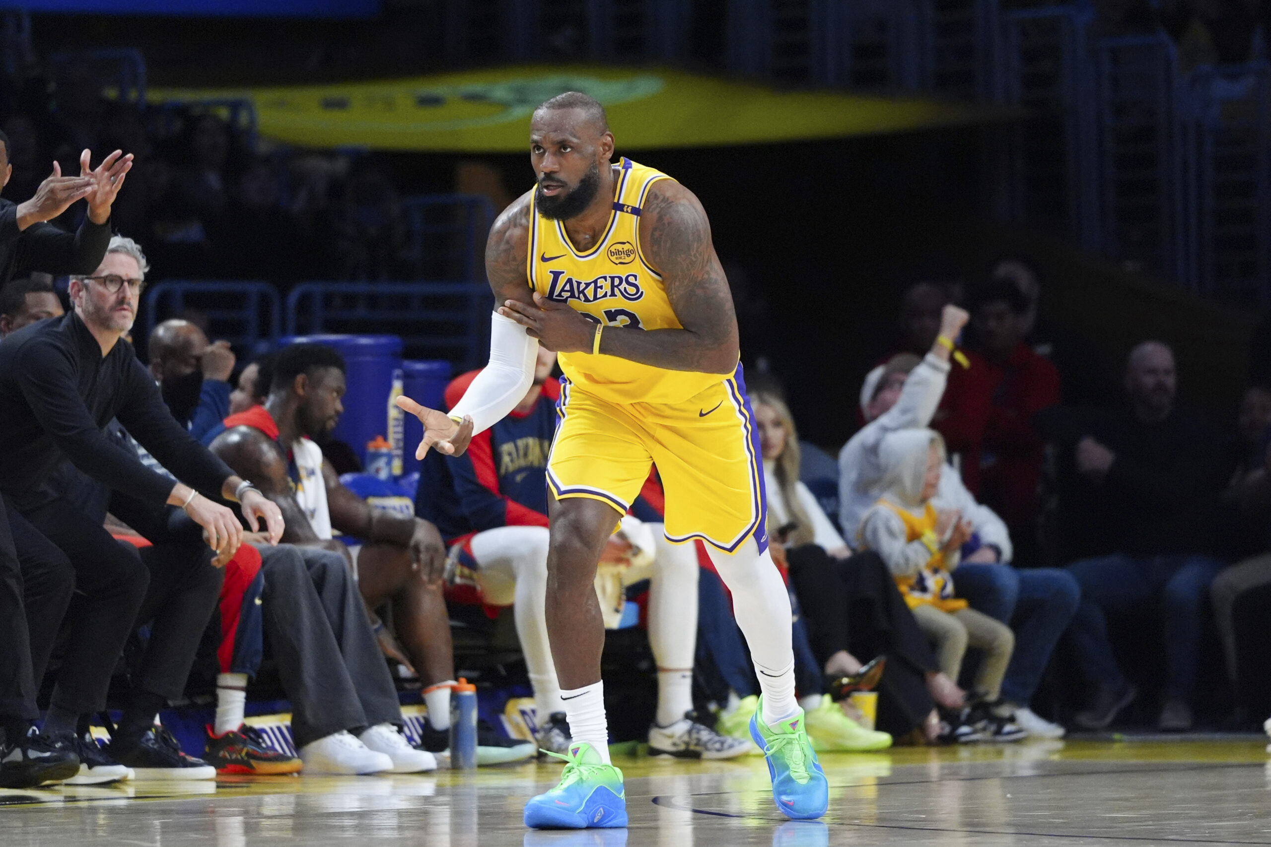 Lakers star LeBron James celebrates after making a 3-point shot...