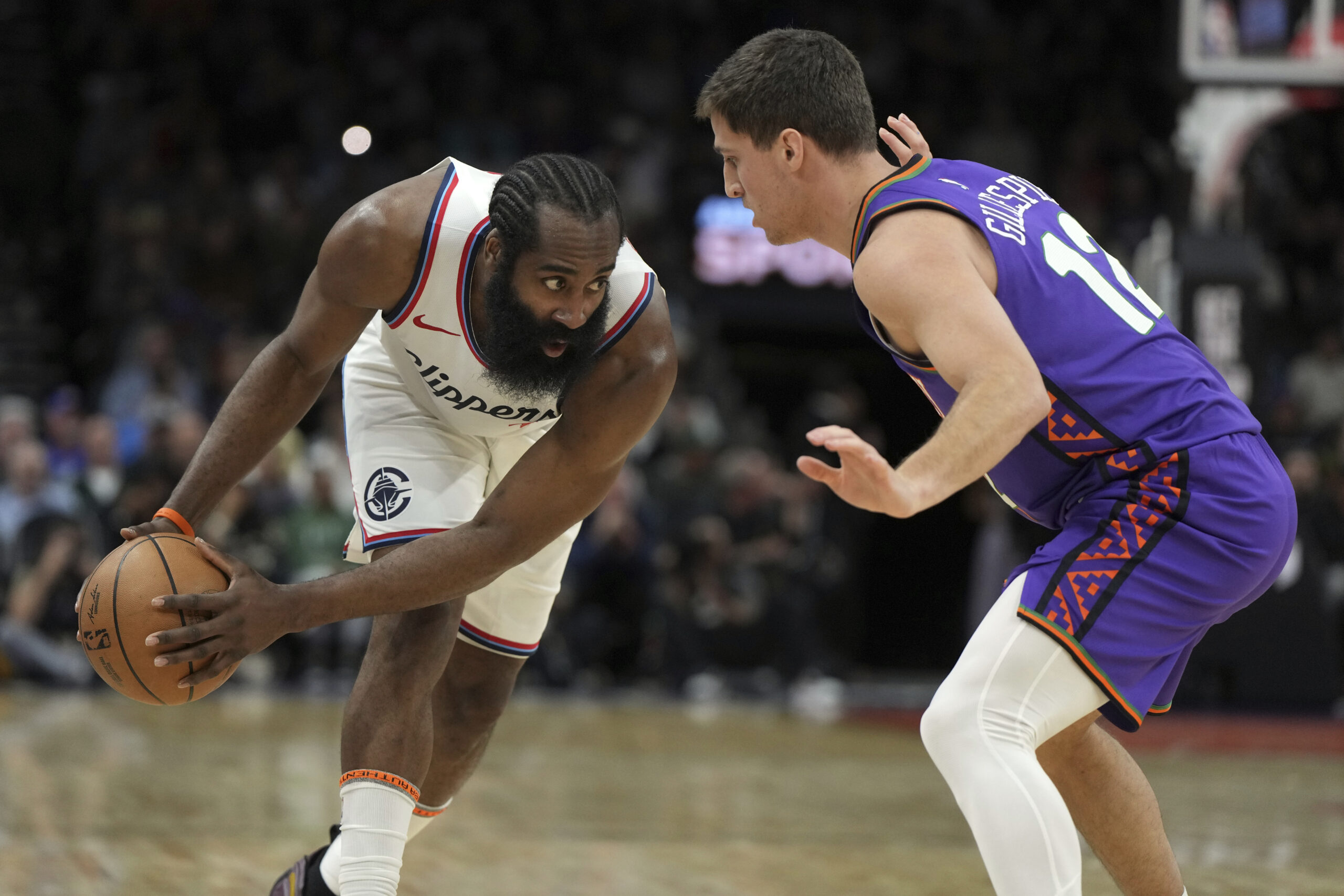 Clippers guard James Harden (1) and Phoenix Suns guard Collin...