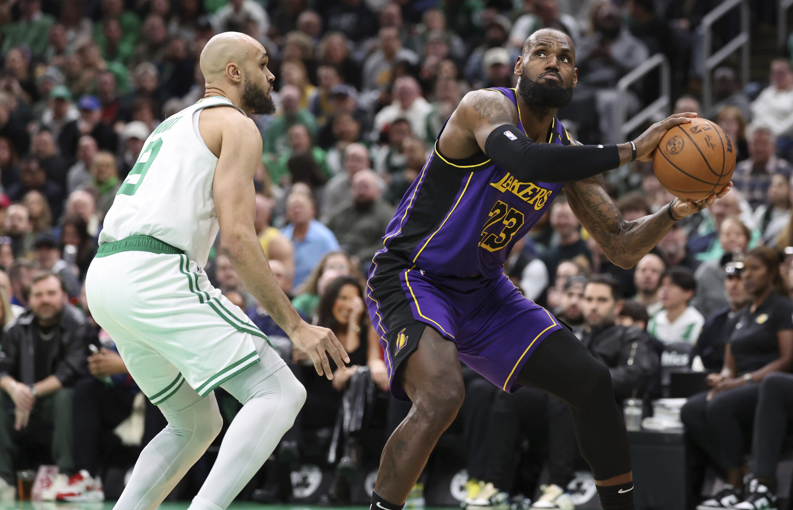 Lakers forward LeBron James (23) eyes the net next to...