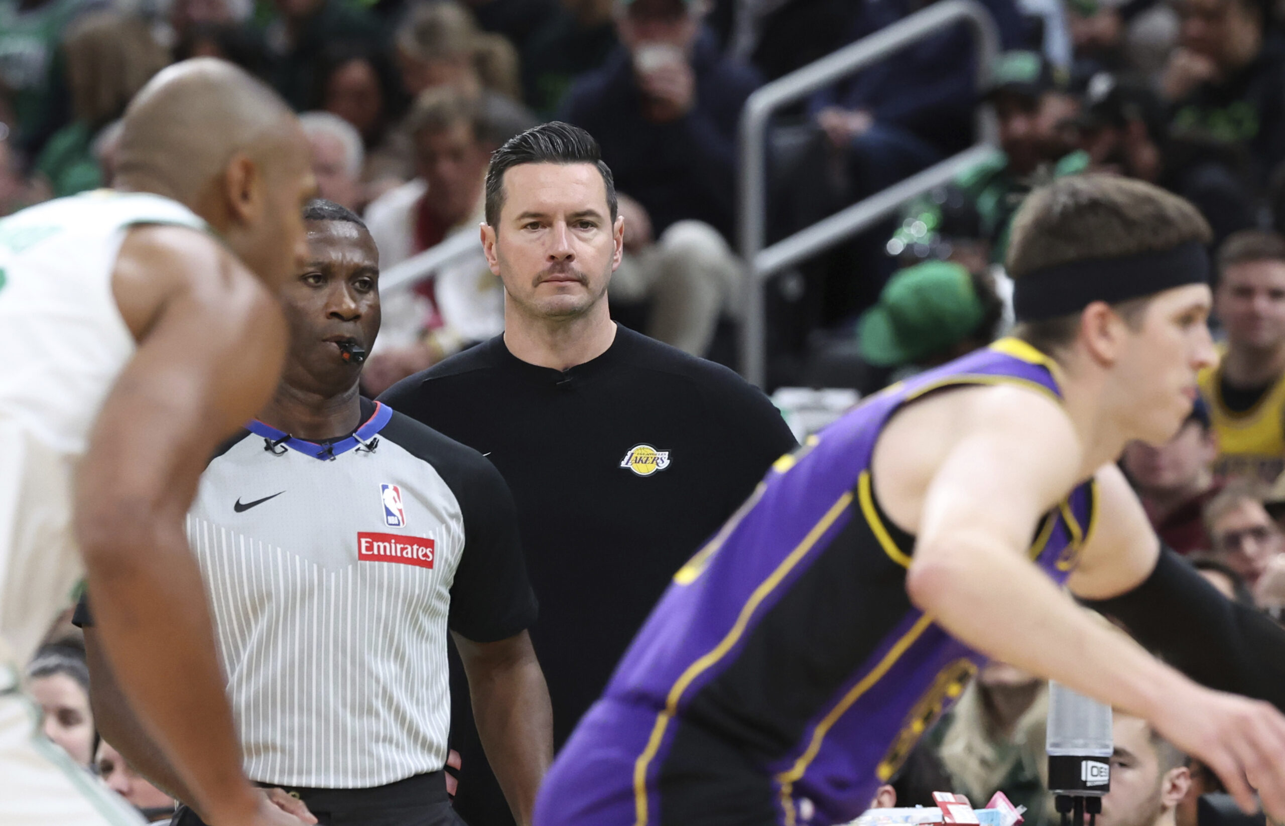 Lakers head coach JJ Redick watches the action from the...