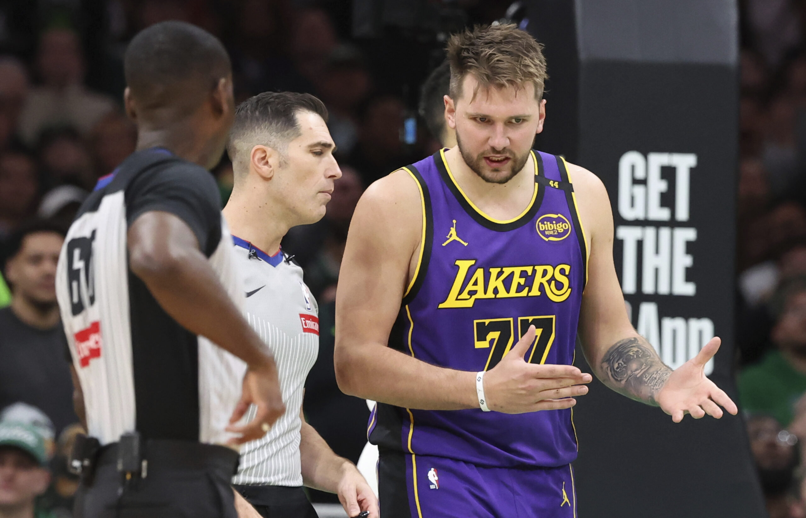 Lakers guard Luka Doncic (77) questions a foul call with...