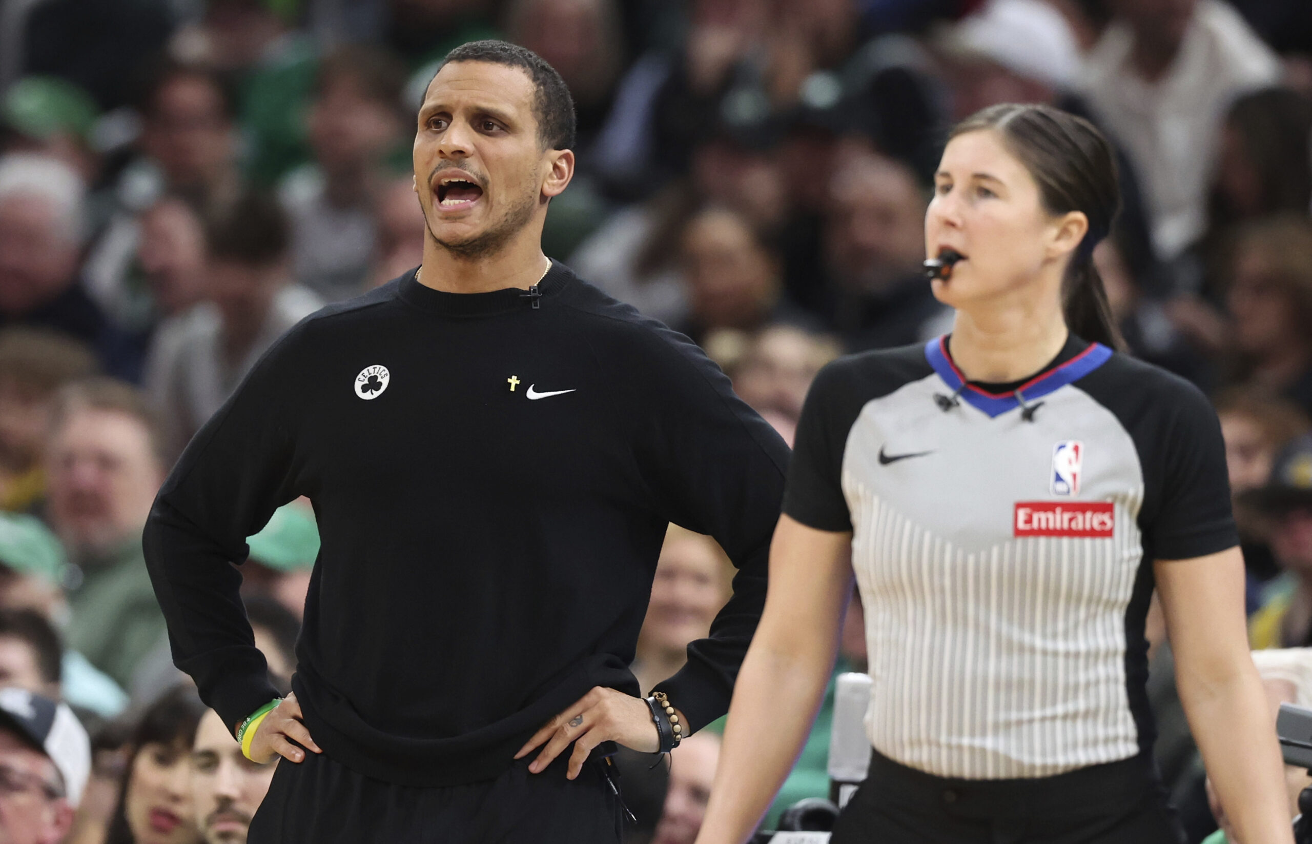 Boston Celtics head coach Joe Mazzulla, left, reacts after a...