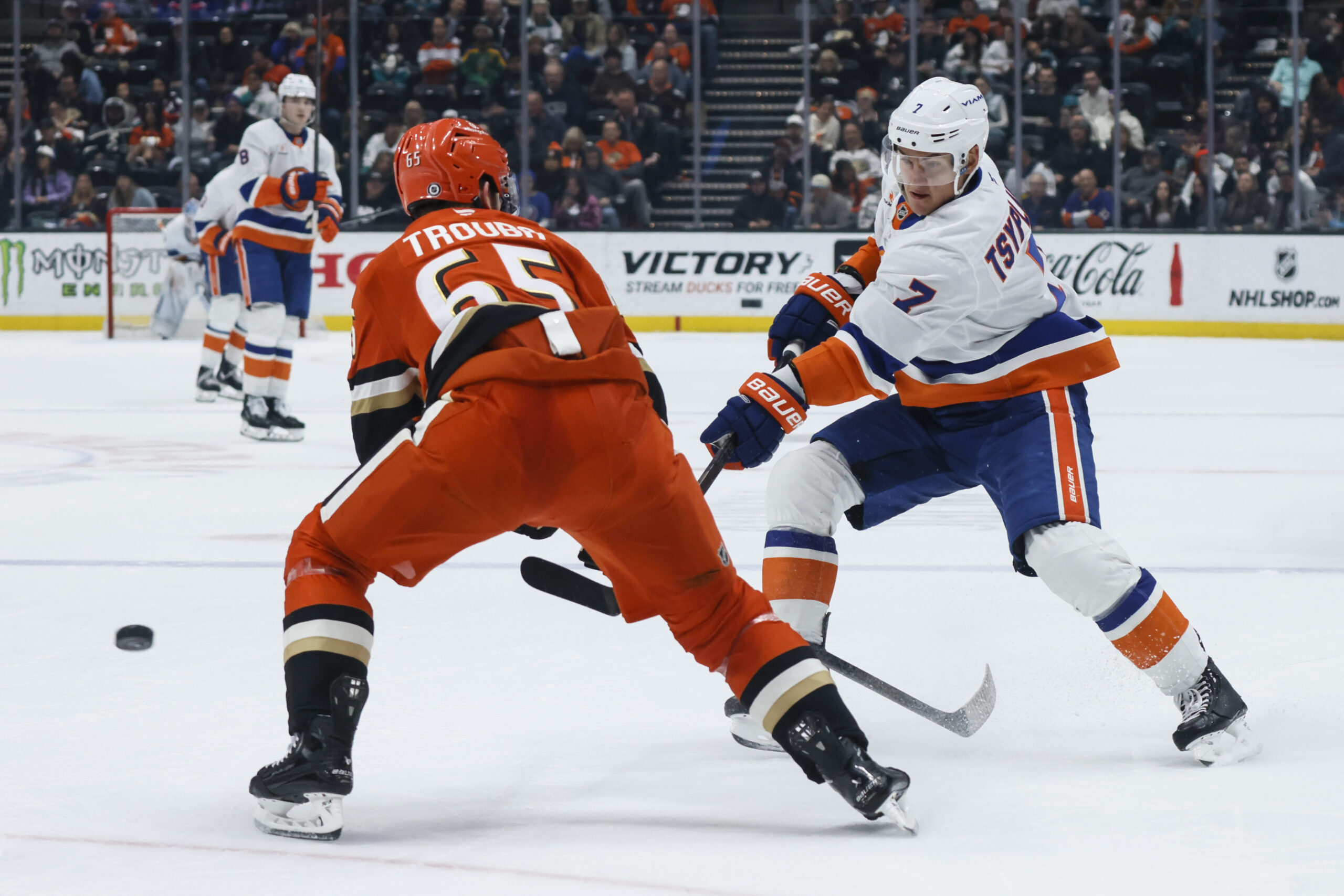 Ducks defenseman Jacob Trouba, left, tries to block New York...