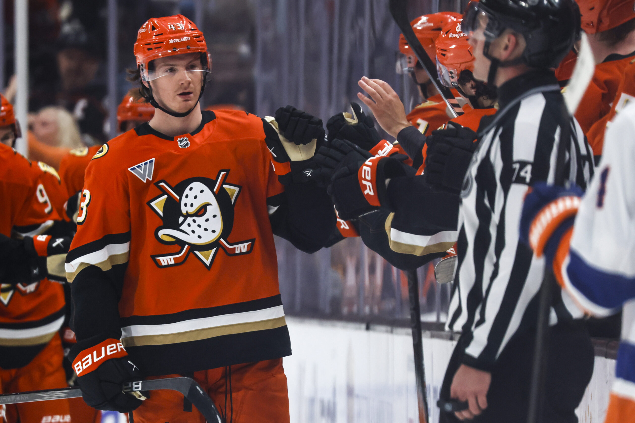 Ducks defenseman Drew Helleson celebrates with teammates after scoring during...