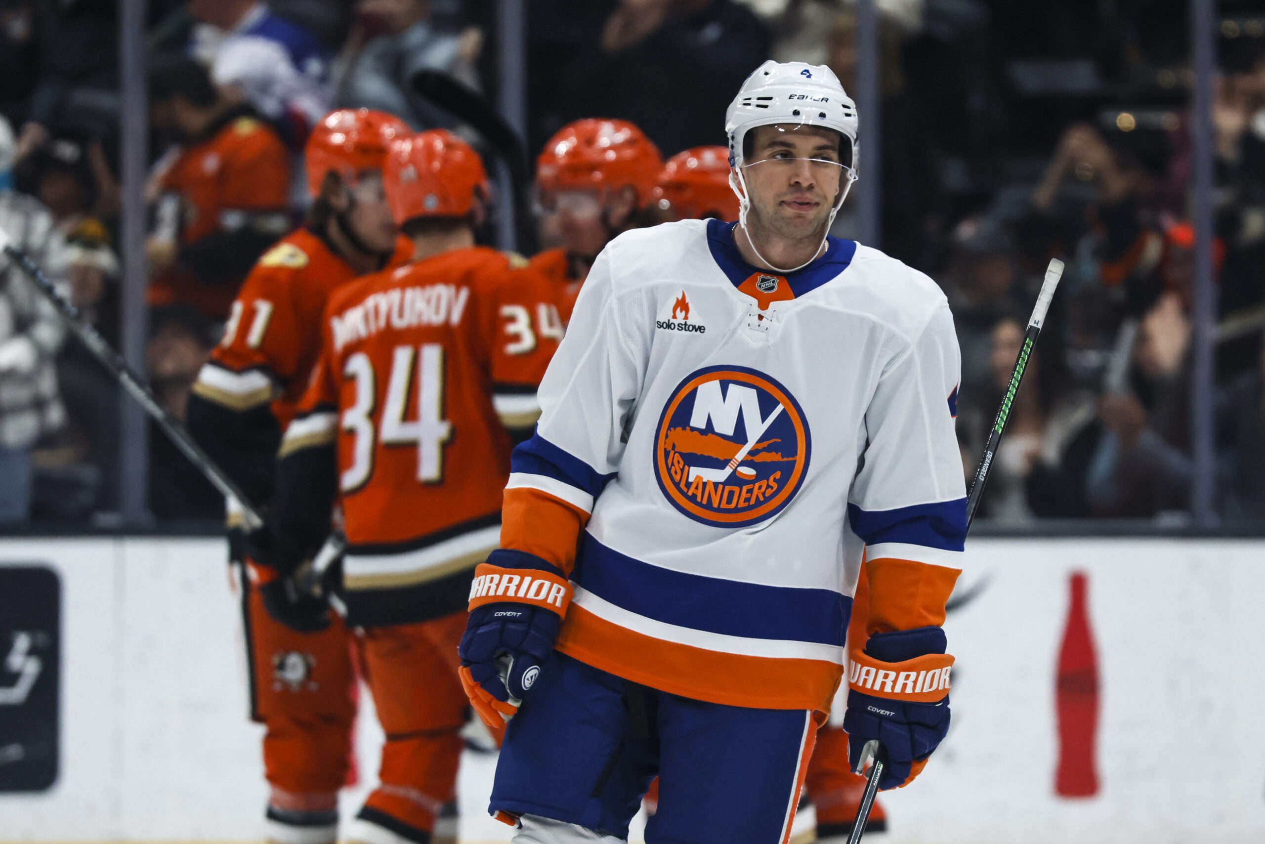 New York Islanders defenseman Tony DeAngelo reacts as Ducks players...