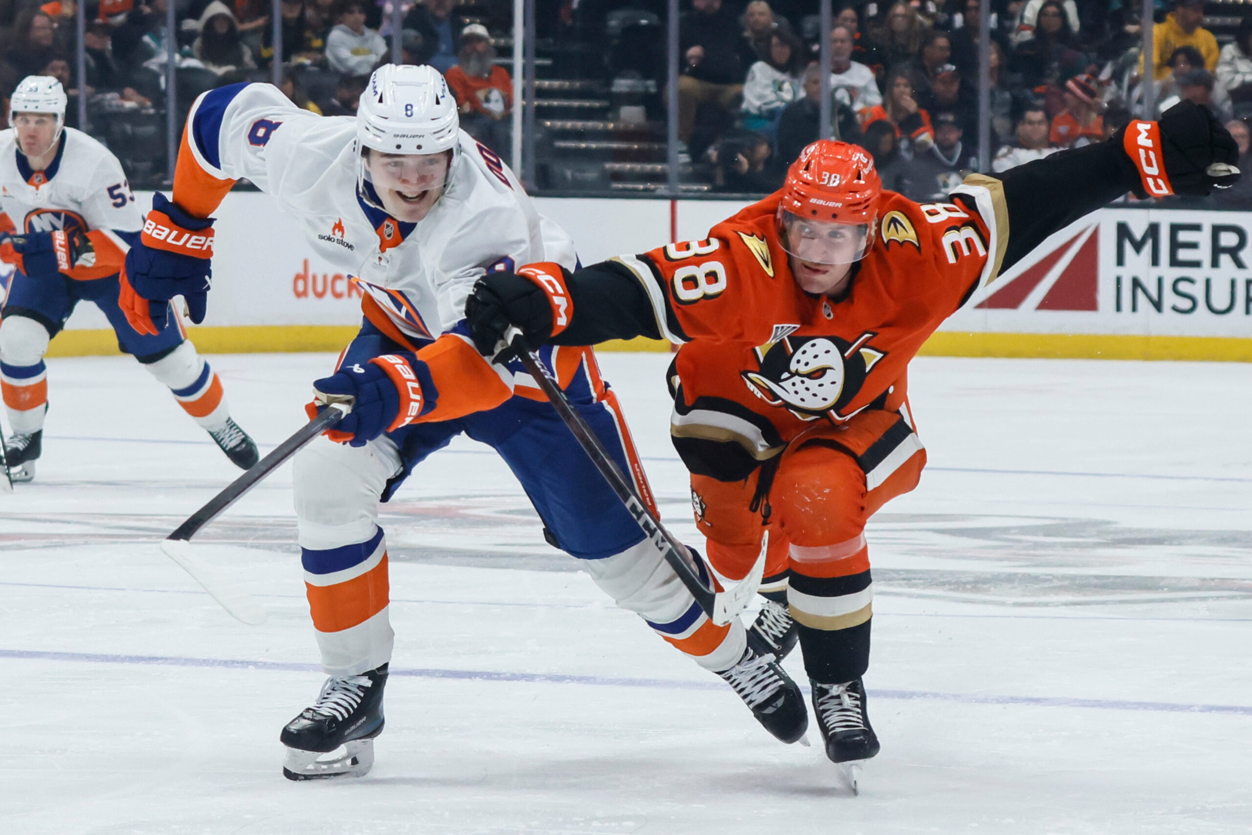 Ducks center Jansen Harkins, right, and New York Islanders defenseman...