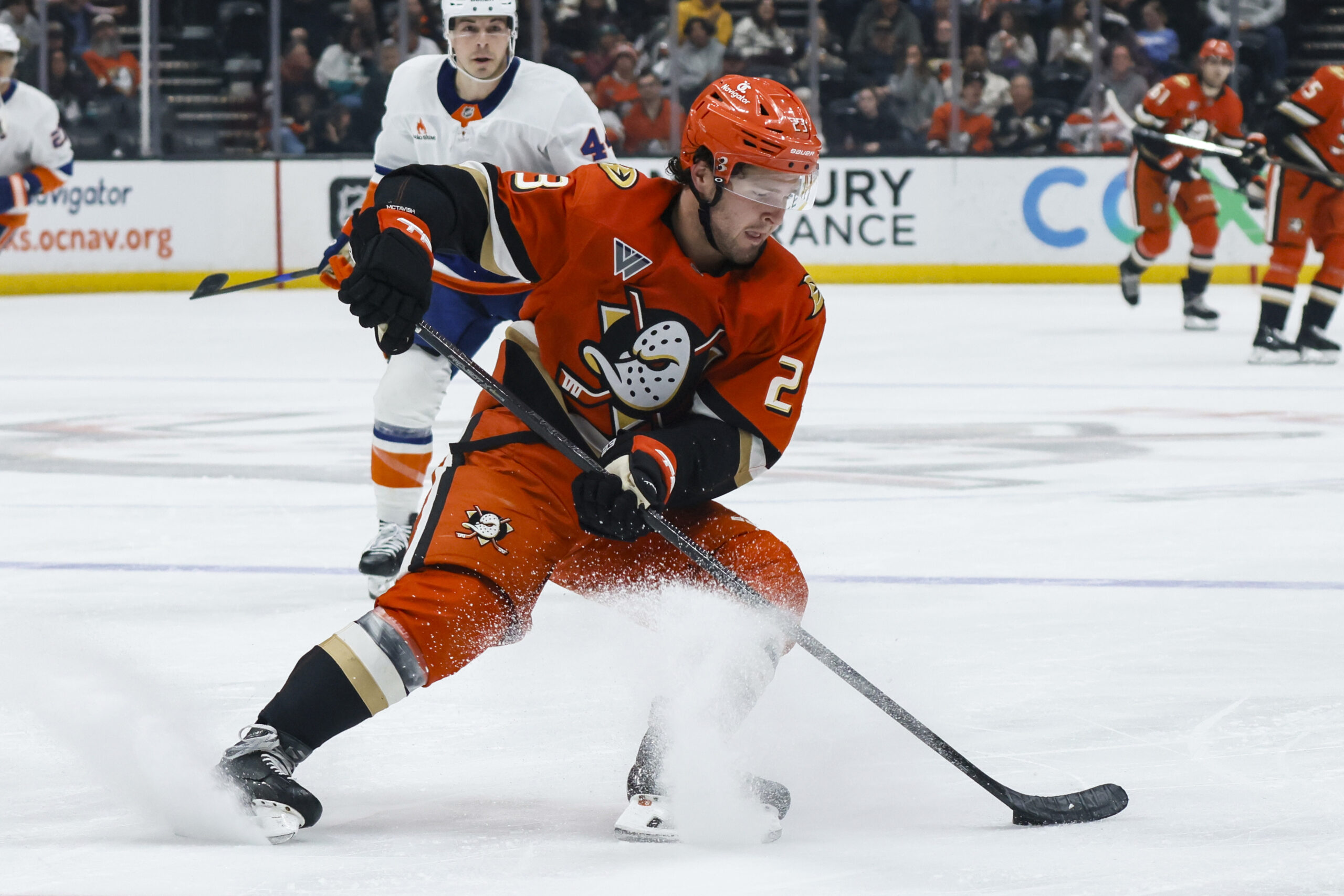 Ducks center Mason McTavish controls the puck during the third...