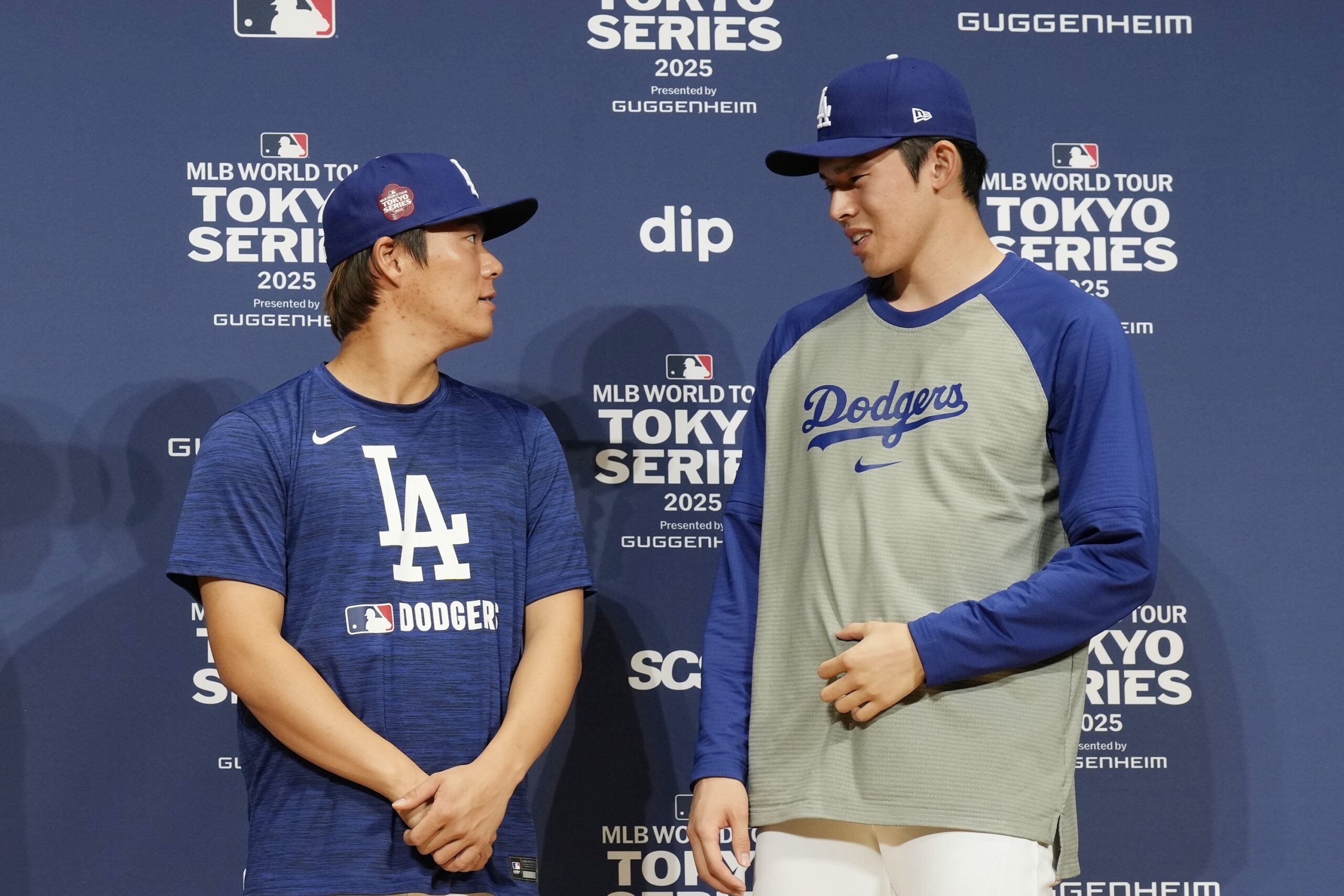 Dodgers pitcher Yoshinobu Yamamoto, left, and pitcher Roki Sasaki, right,...